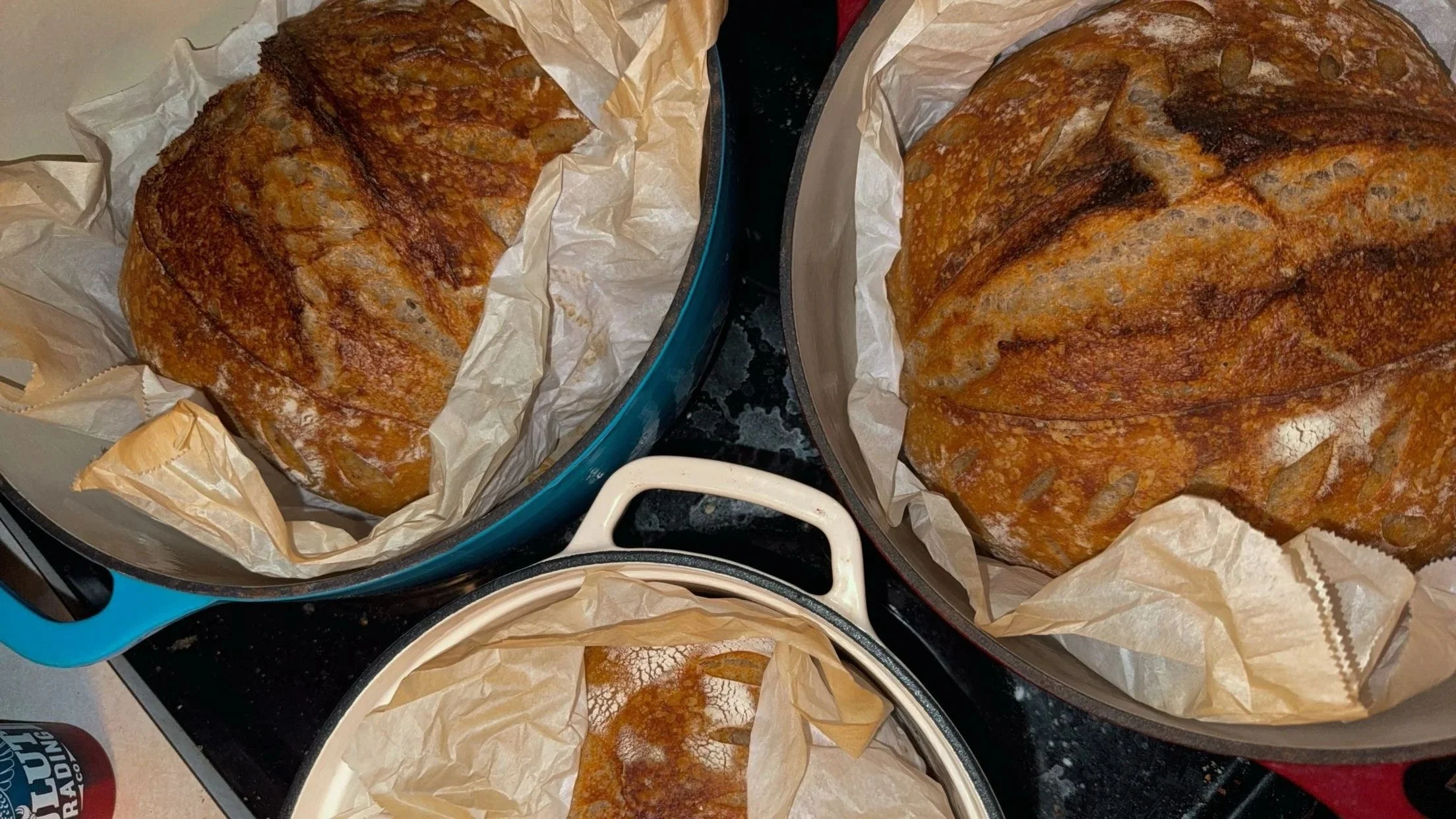 Two large, artisan inspired sourdough loaves.