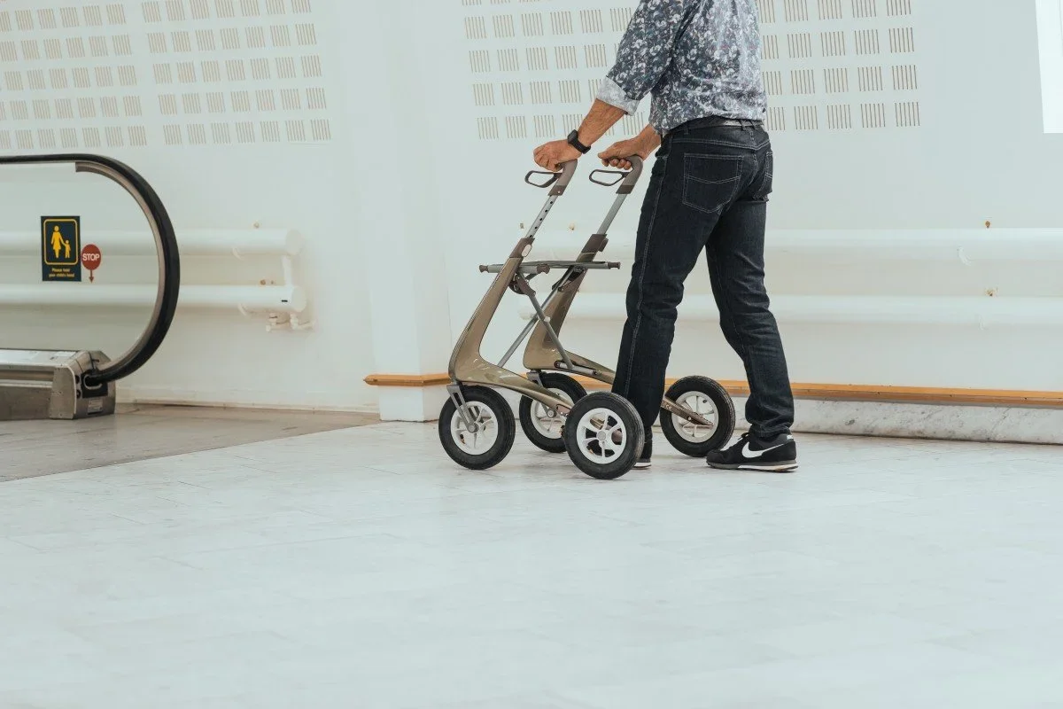 Woman using ByAcre Carbon Overland rollator