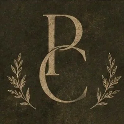Lettering 'P' and 'C' with decorative laurel branches on dark background.