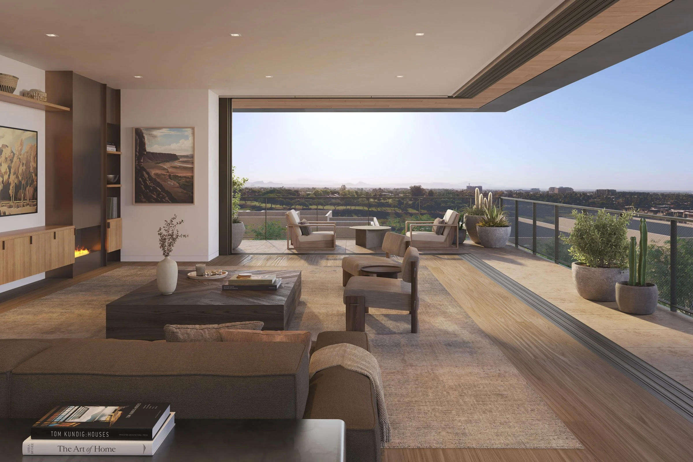 Modern living room with large glass sliding doors opening to a balcony overlooking a cityscape and distant mountains