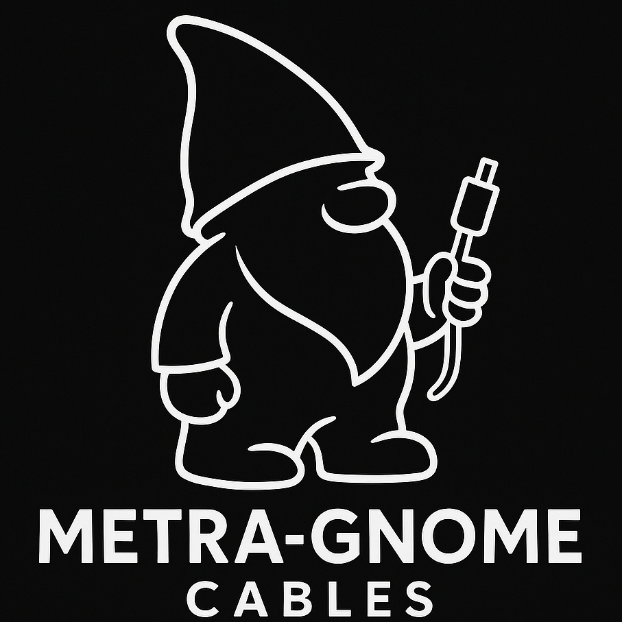 A line drawing of a gnome wearing a pointed hat, holding a cable with a connector, with the text "METRA-GNOME CABLES" below.
