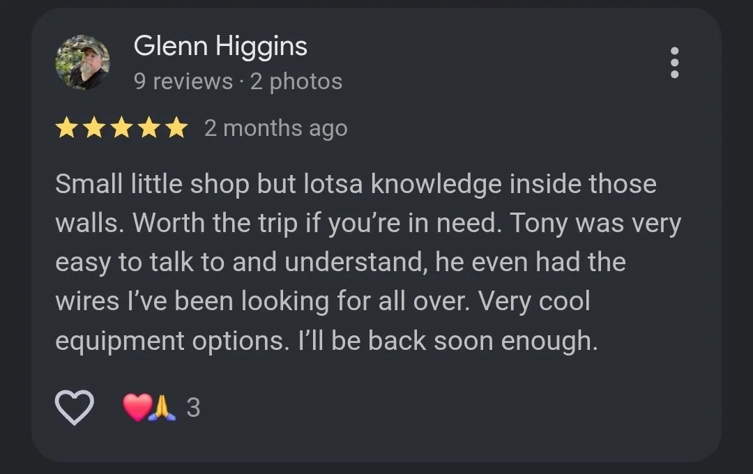 Screenshot of a Facebook review from Glenn Higgins praising a small shop and mentioning Tony, who is knowledgeable and helpful, with positive comments about equipment options.