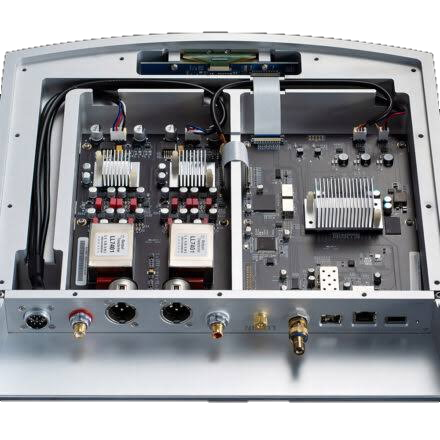 Open electronic device showing internal circuit boards, connectors, and wiring.
