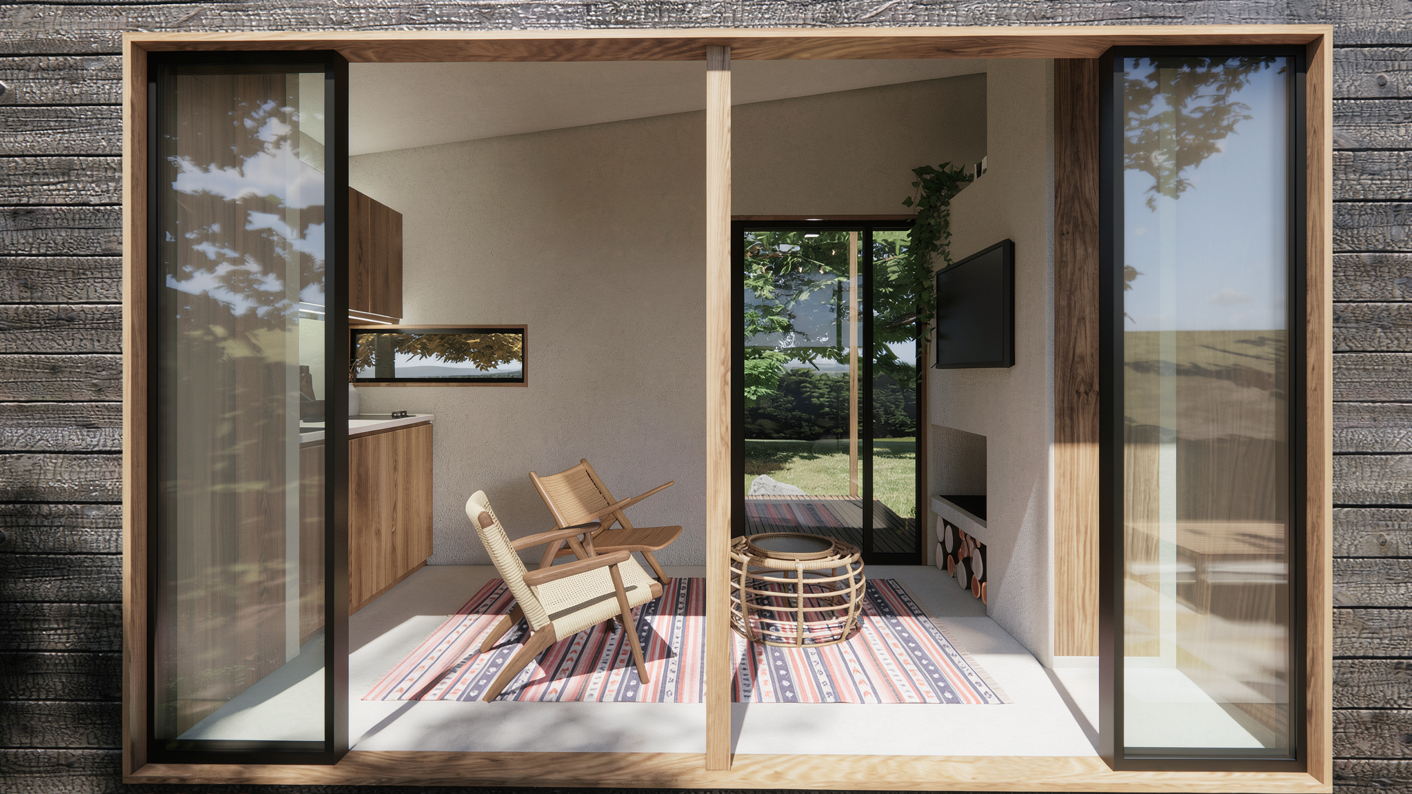 Vista de un balcón con muebles de madera, sillas de mimbre y una alfombra con rayas, con puertas corredizas de cristal y paredes blancas, rodeado de naturaleza.