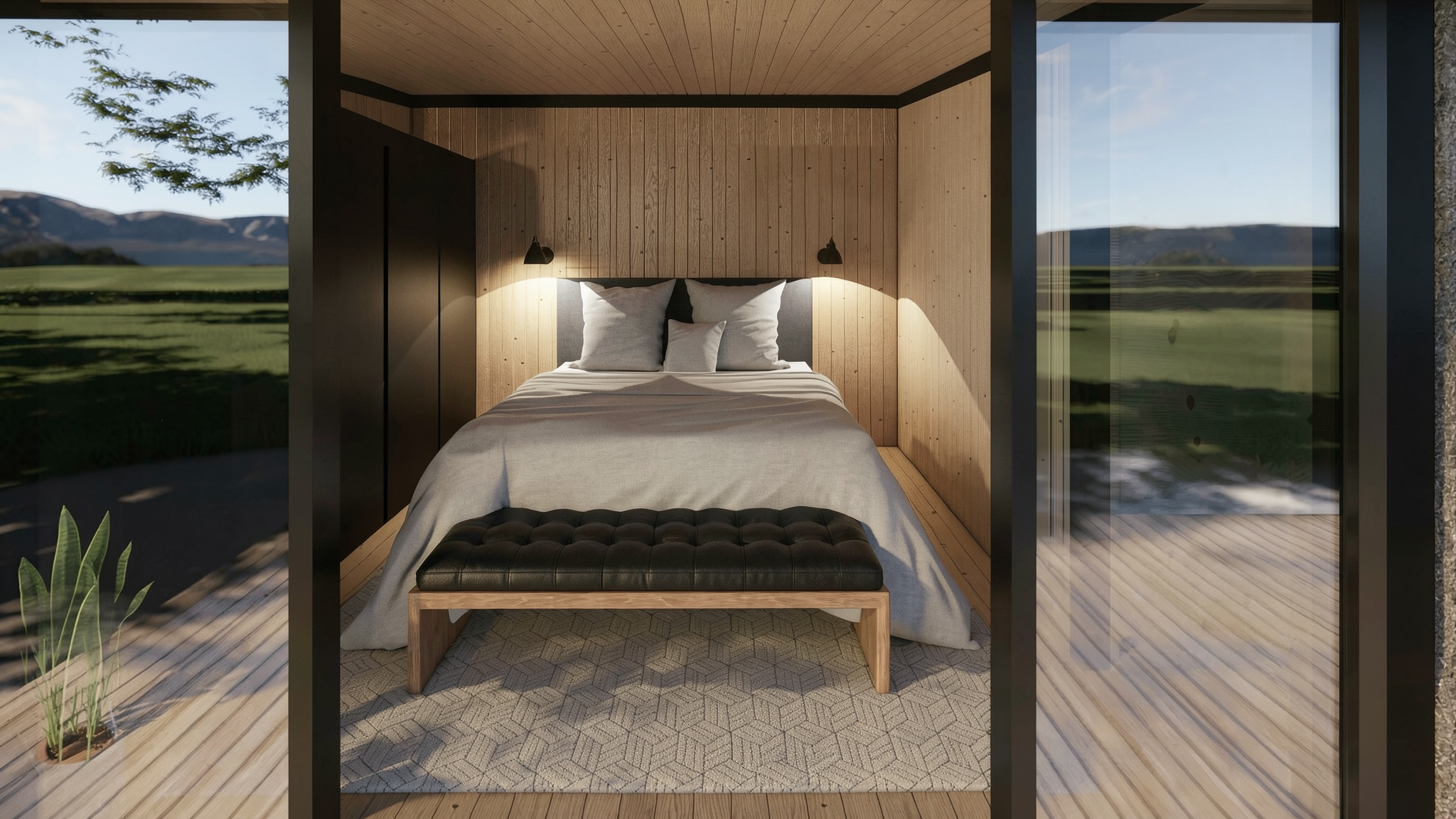 Habitación moderna con vista a un paisaje de montañas y campos verdes desde grandes ventanas, con cama decorada en colores neutros y detalles en madera.