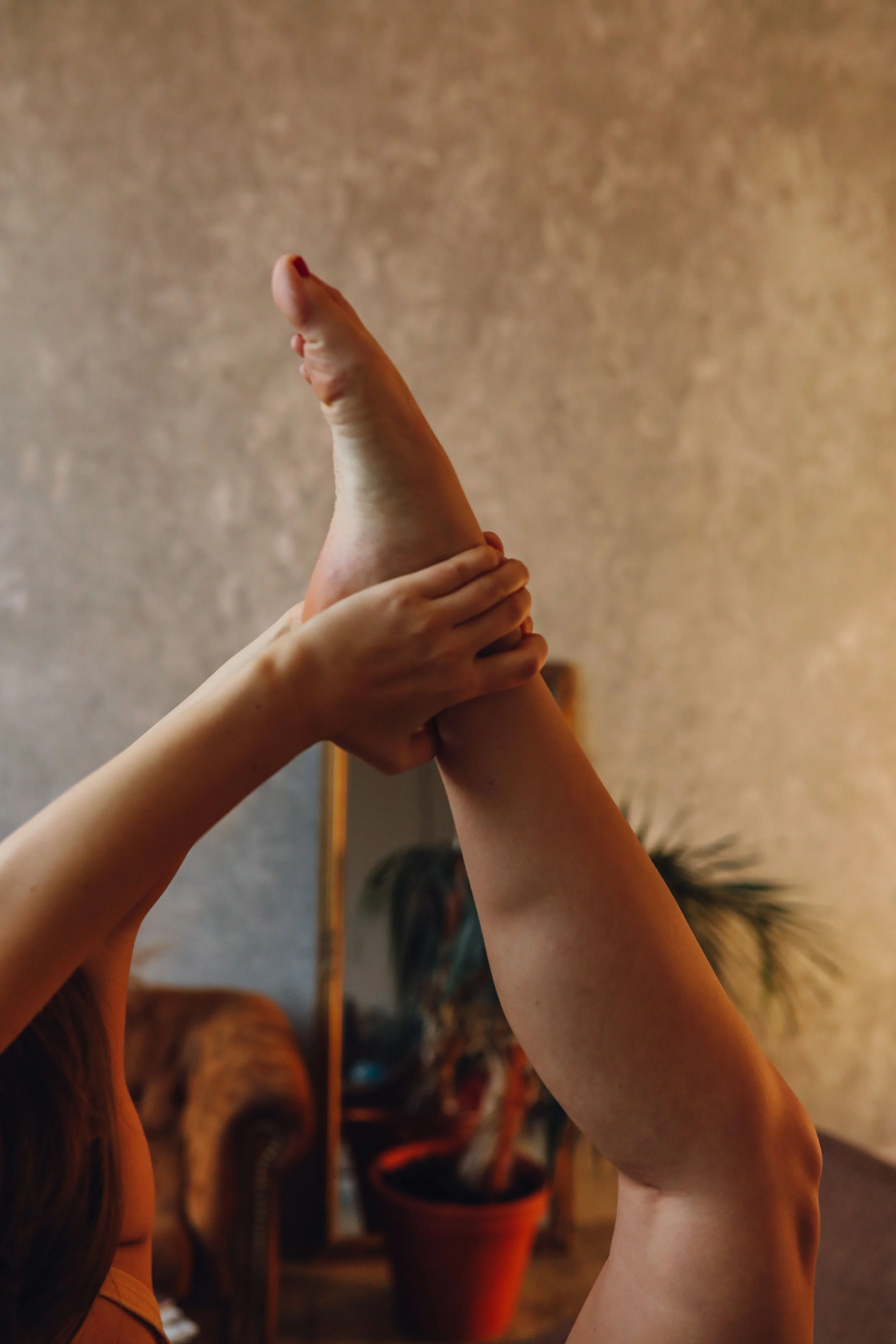 Woman holding her smooth leg after a professional leg waxing treatment