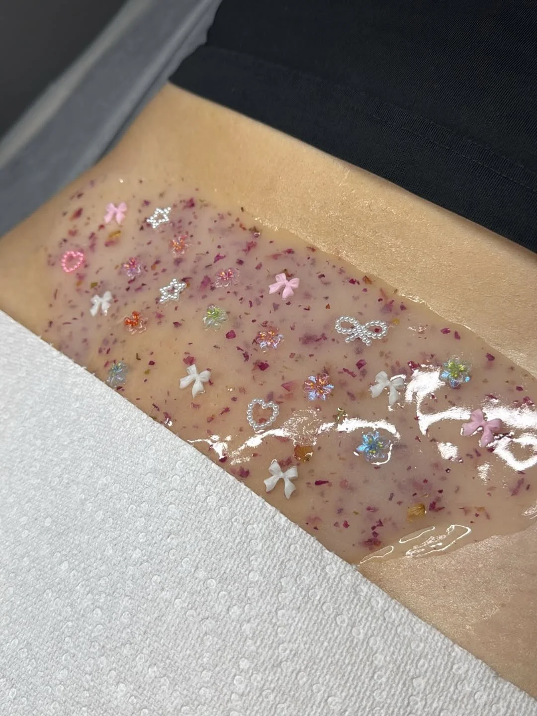 Hydrating jelly mask with floral ingredients applied during a professional skincare vajacial