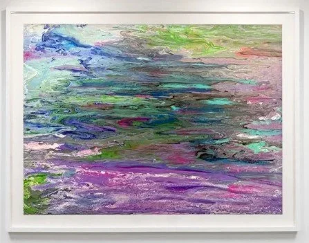 Abstract painting with swirling colors including blue, green, purple, pink, and white, framed in white.