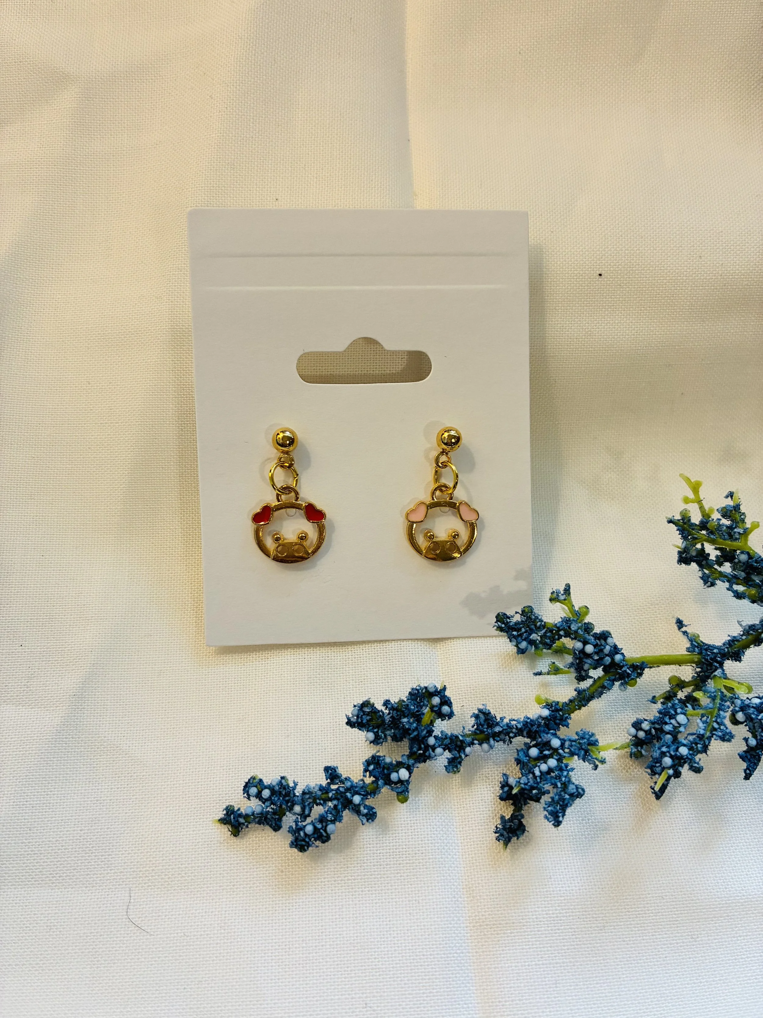 Piglet mismatched earrings