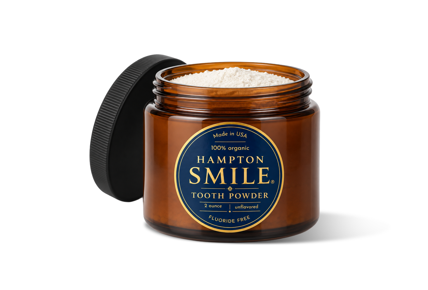 Hampton Smile Tooth Powder in an open glass jar with its lid.