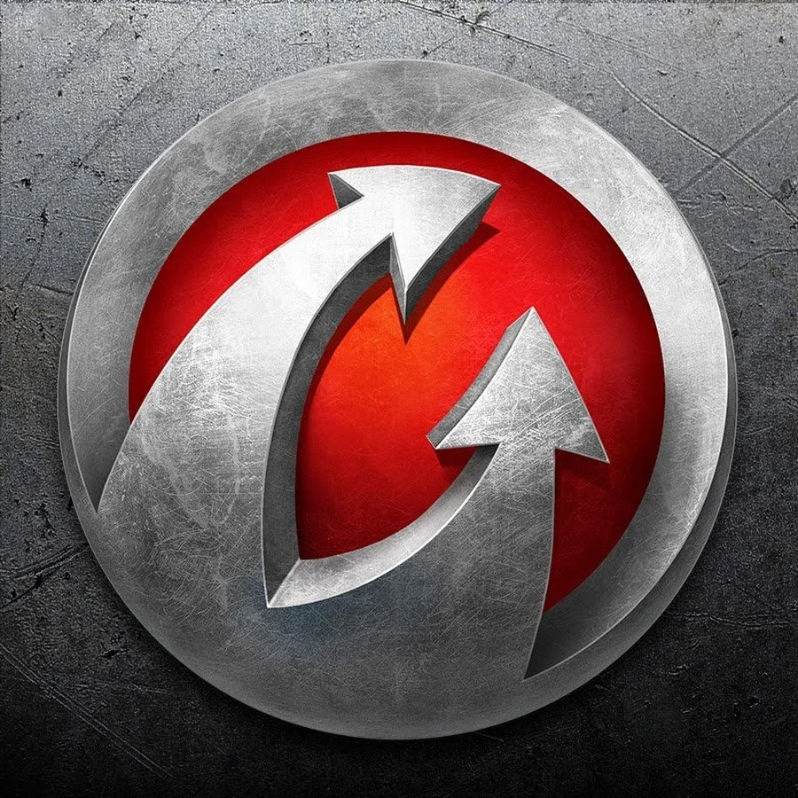 Close-up of a metallic circular emblem with two curved arrows forming a cycle, set against a textured gray background.