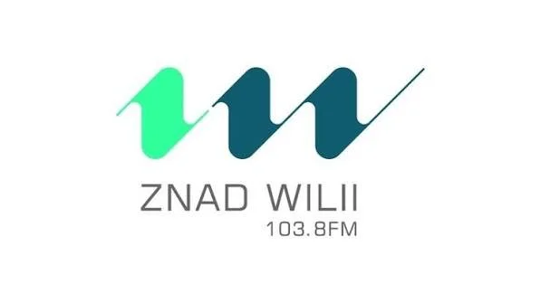Logo for Znad Wilii radio station with frequency 103.8 FM, featuring stylized green and blue waves.