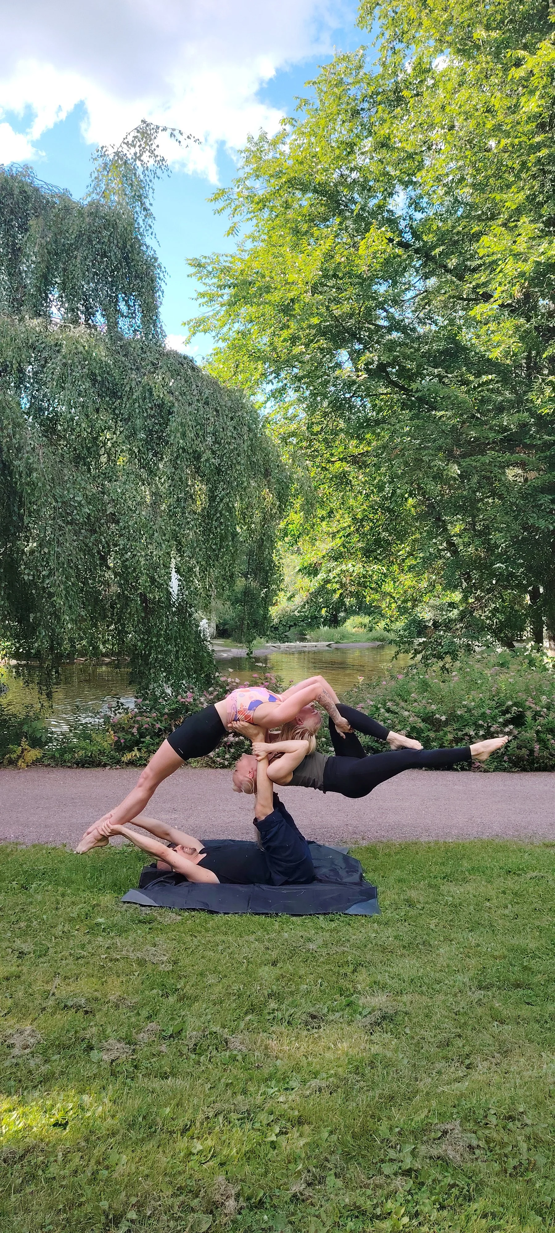 Acroyoga in Helsinki, in Finland in the park. Akrojoogaa puistossa  Suomessa,Helsingissä