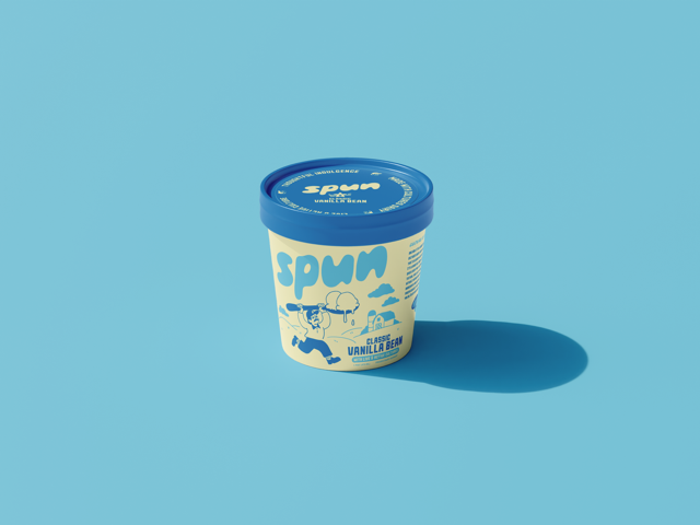 A tub of vanilla bean flavored ice cream with a blue lid and a cartoon character on the label, casting a shadow on a light blue background.