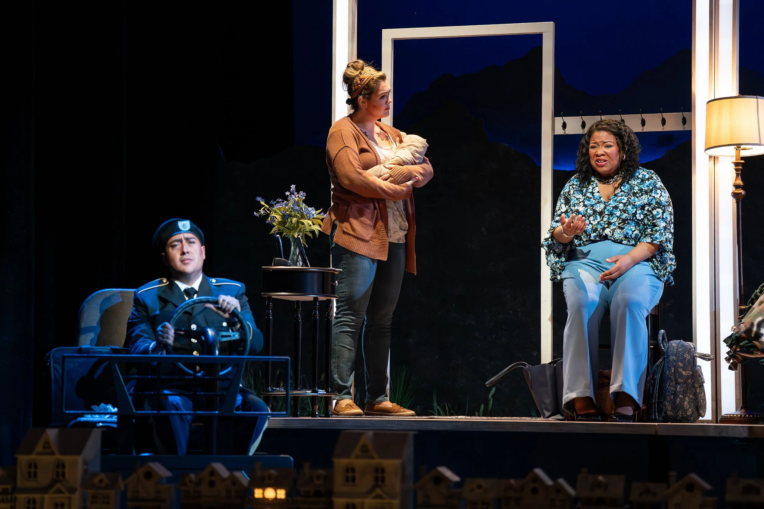 The car and entry parlor onstage for the opera “The Knock”