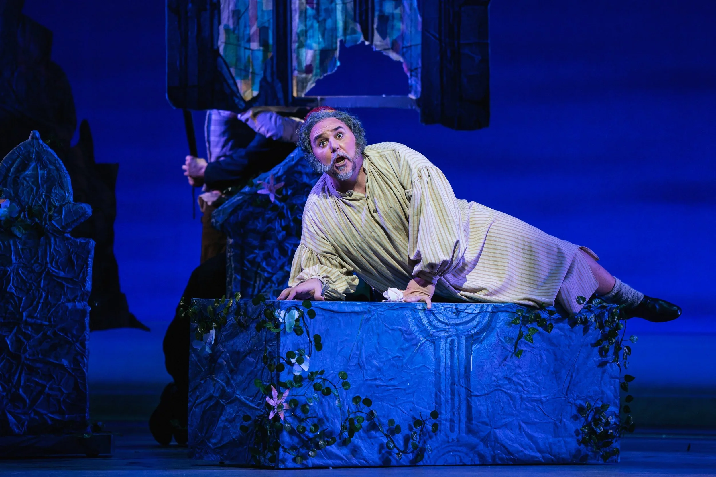 The father laying on a decorated coffin in a church in the opera “The Pirates of Penzance”