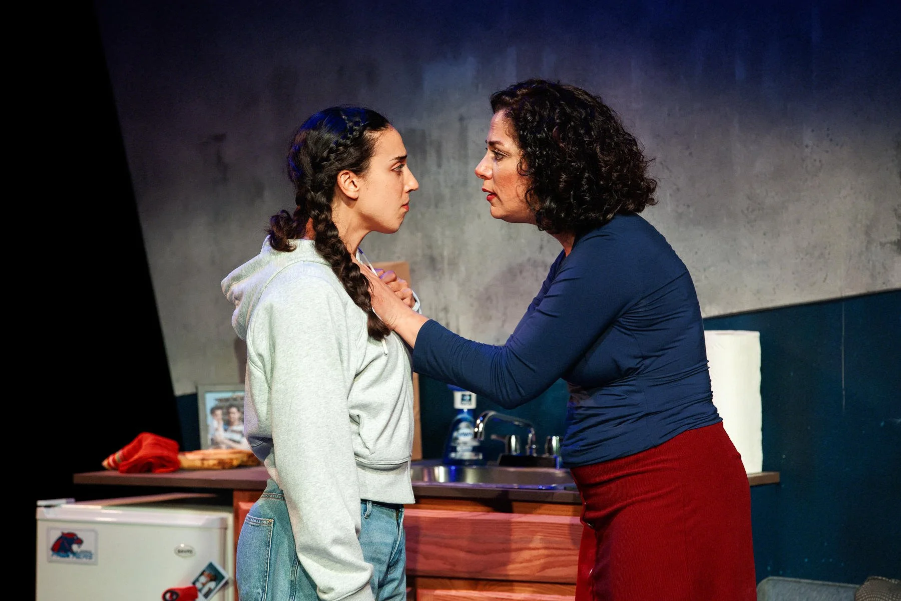 Close-up of mother and daughter in the play “American Fast” by Kareem Fahmy