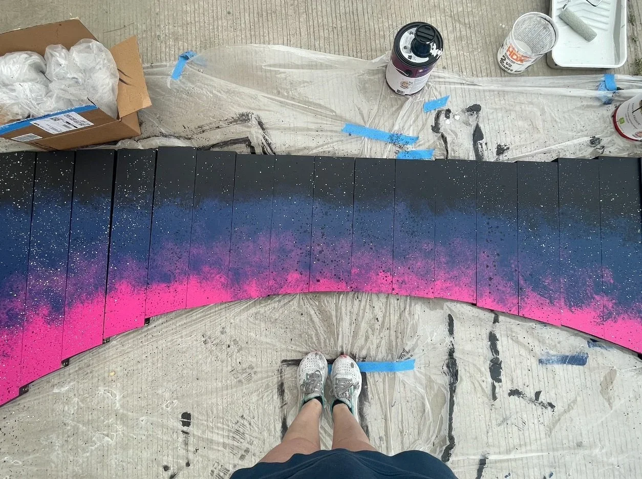 Painting process photo of the proscenium arch for the world premiere Opera “The Magic Hummingbird”