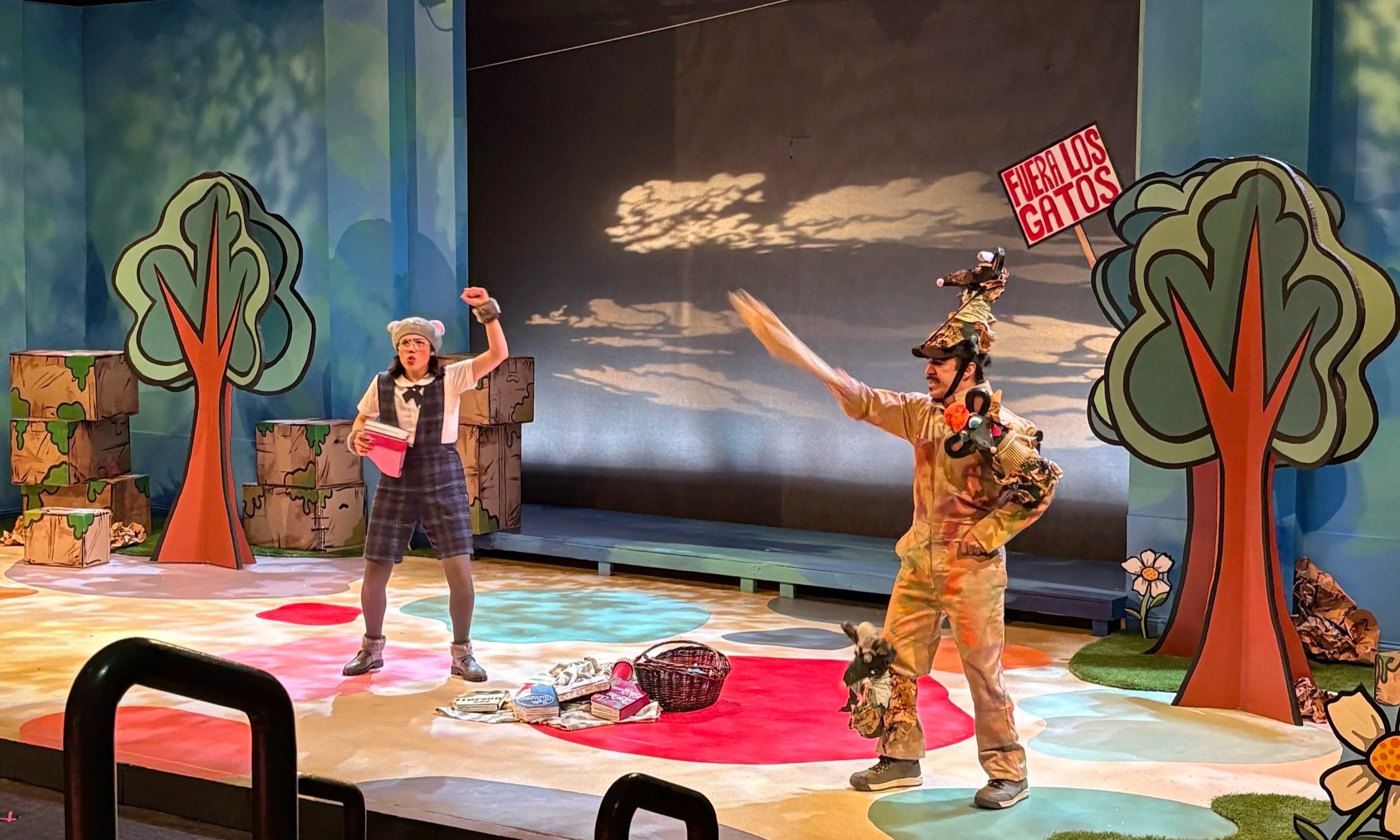 Actors participating in a rally with a protest sign during the theater kids’ show “Séneca, The Library Mouse” by Jorge Diaz