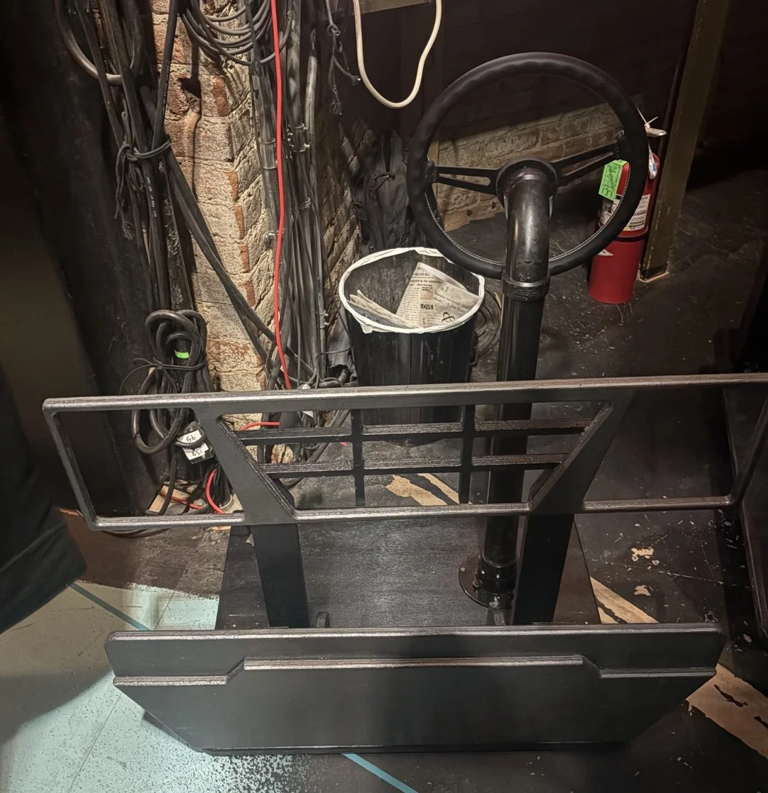 Backstage photo of the front platform of the car for the opera “The Knock”