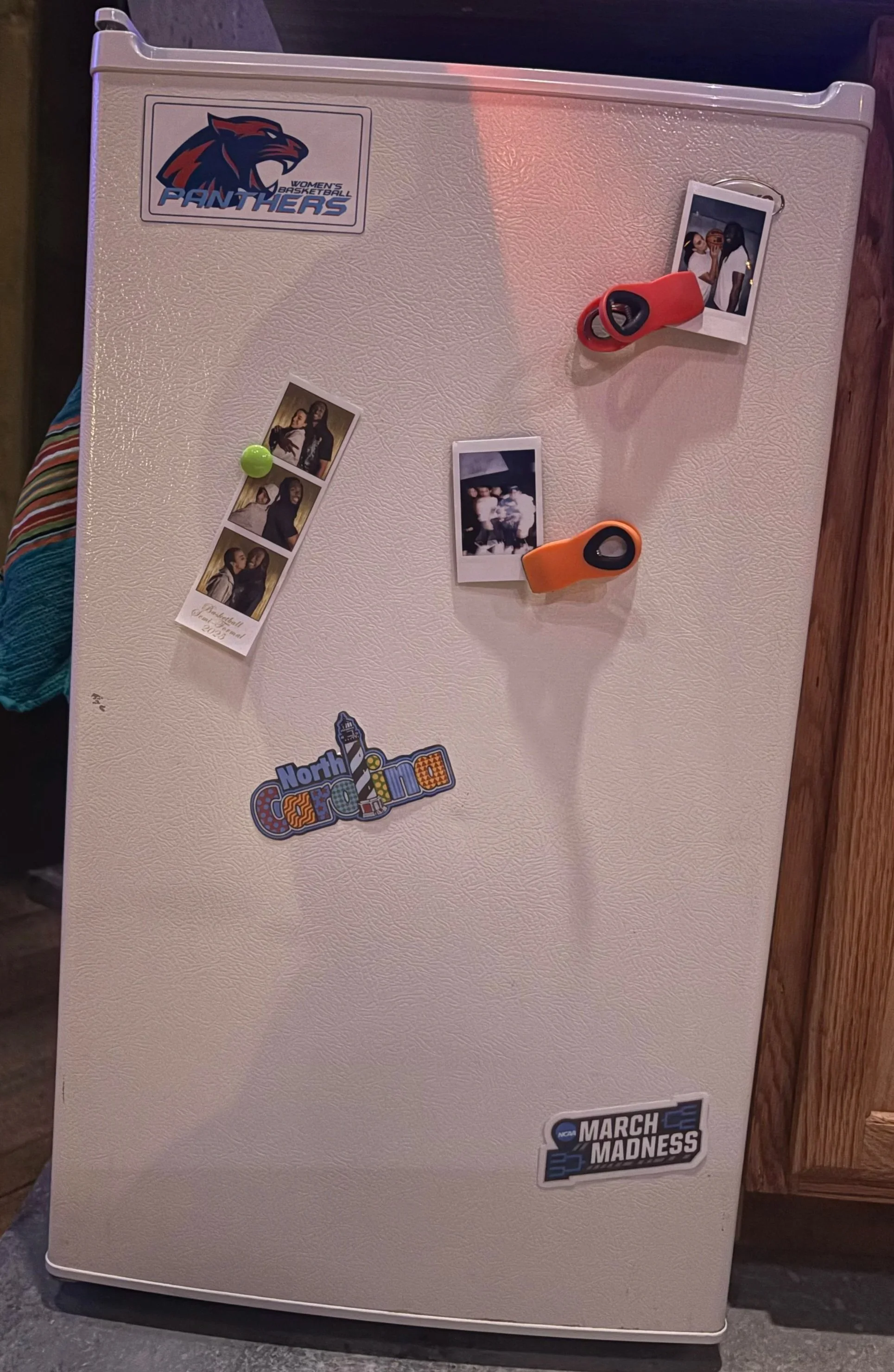 Dorm room fridge decorated with graphic designed set dressing for the play “American Fast” by Kareem Fahmy