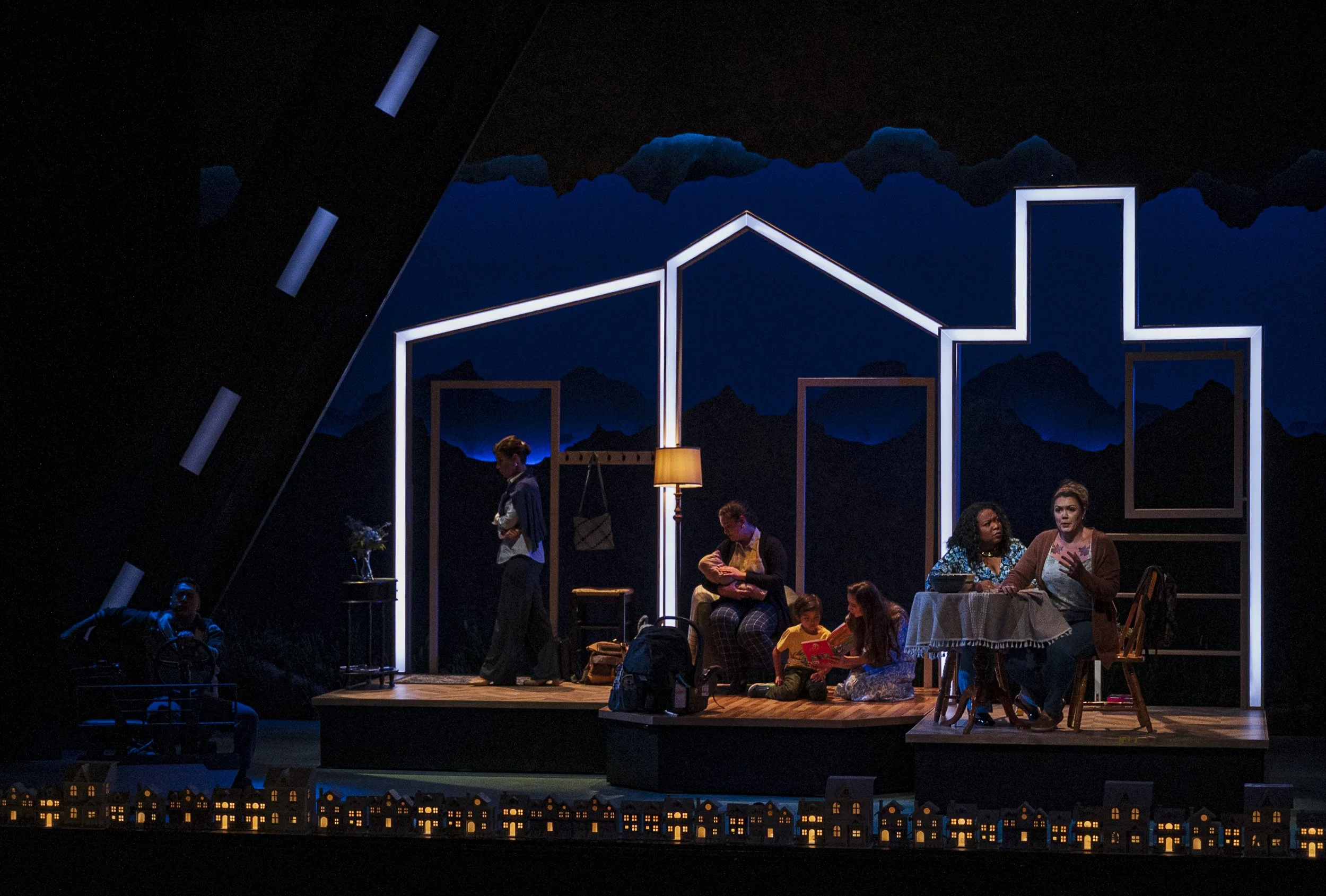 A wide-shot of the house moved and redressed to be one continuous house in the opera “The Knock”