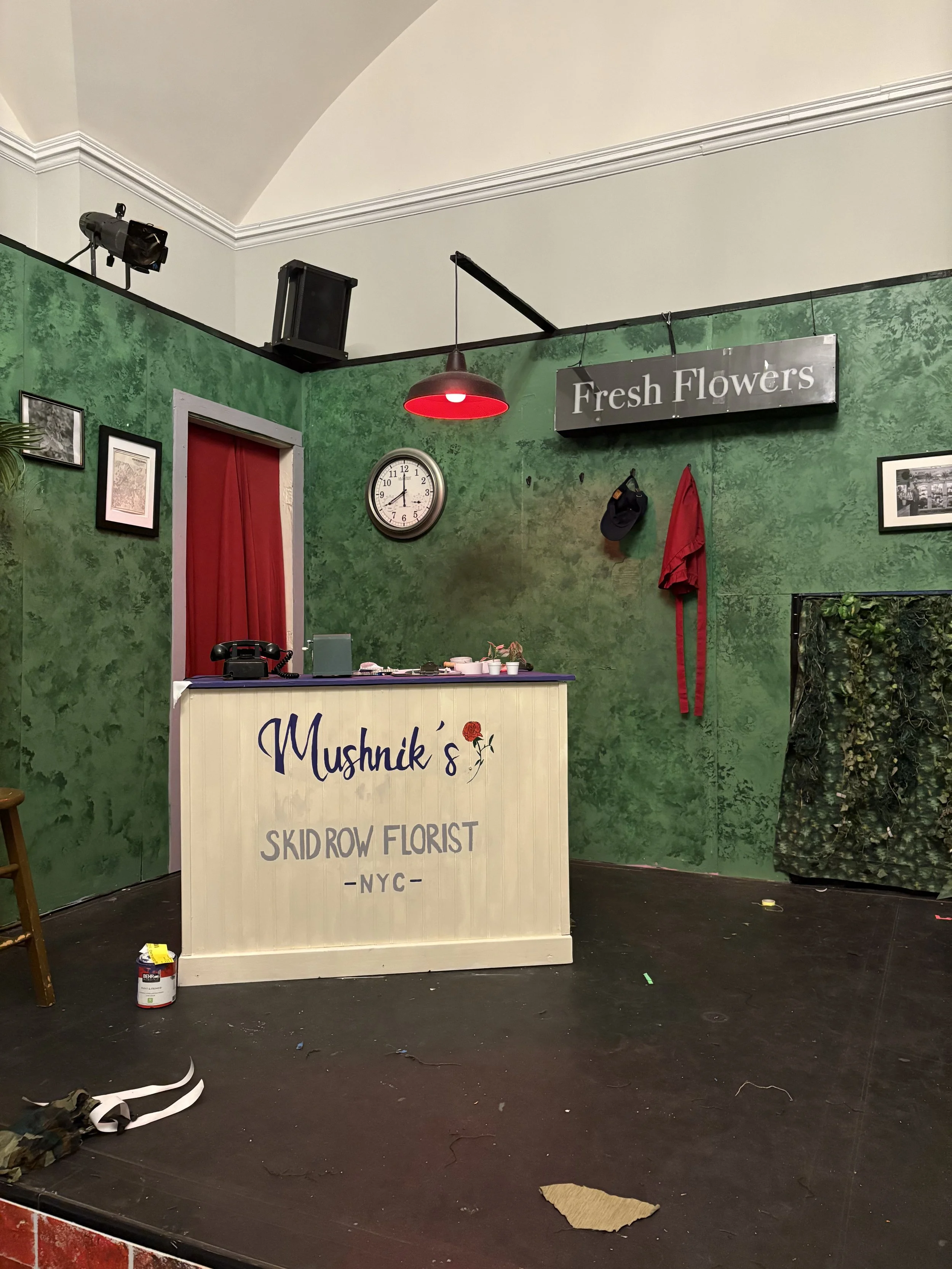 Close up of the hand designed and painted florist shop logo for the musical “Little Shop of Horrors” by Alan Menken and Howard Ashman
