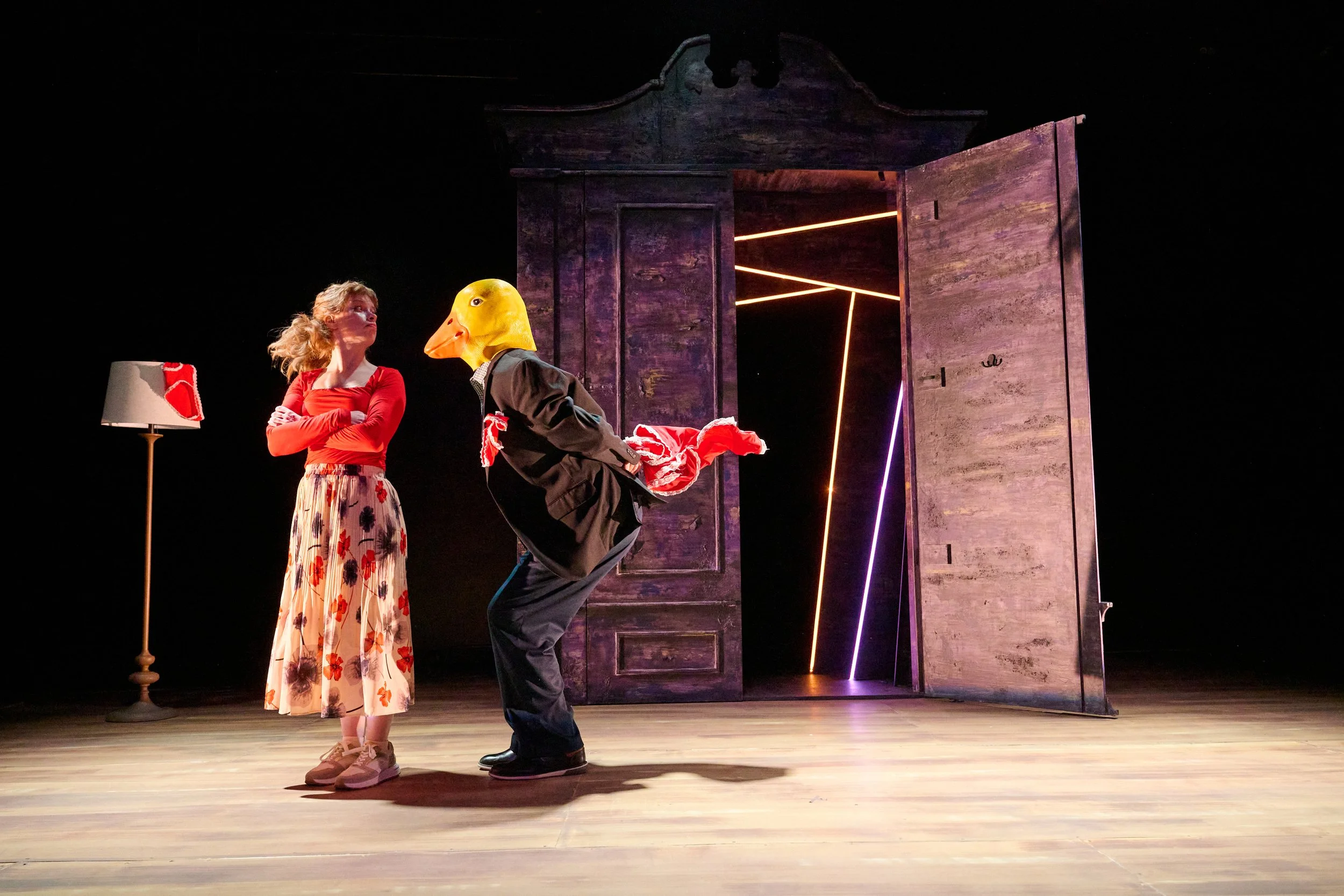Dancing woman and duck man onstage in the North American premiere of “Lie Low” by Ciara Elizabeth Smyth
