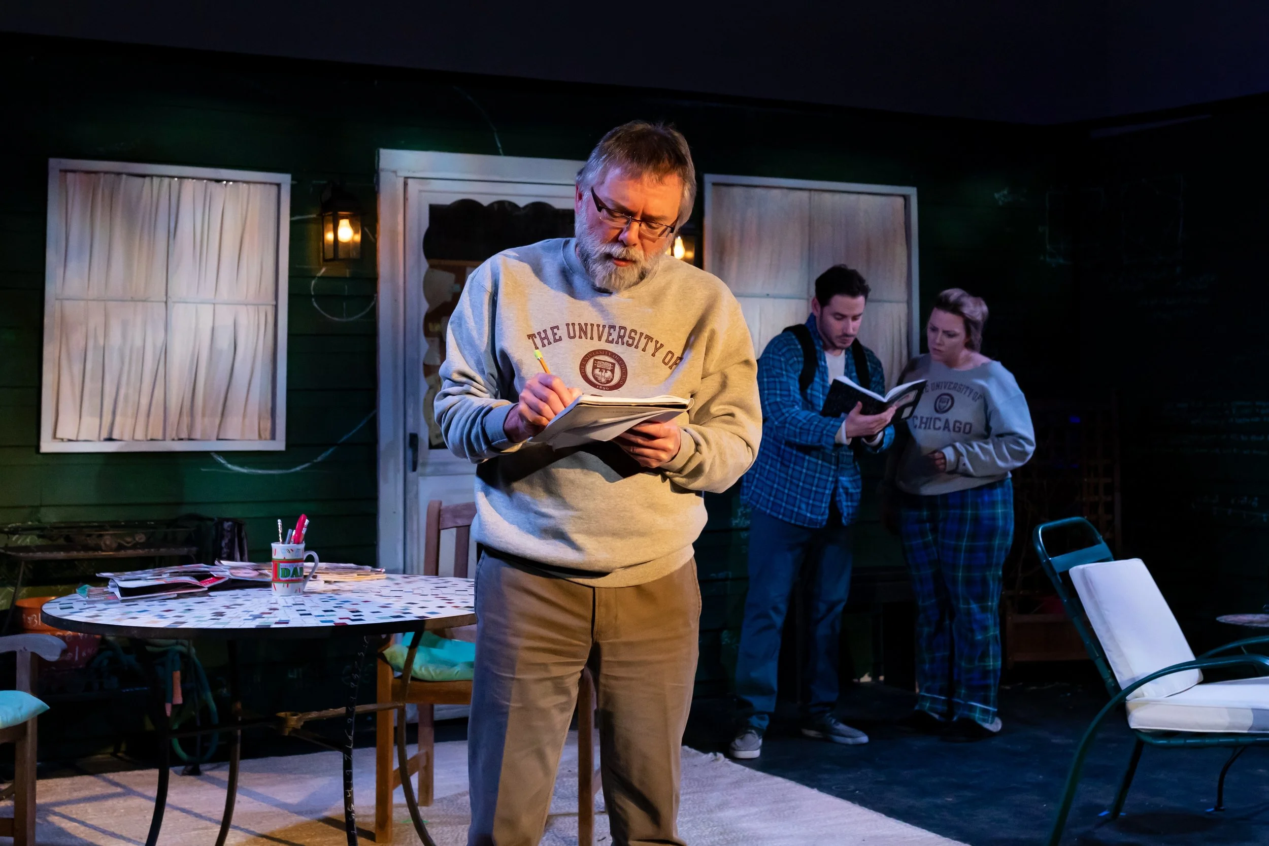 Robert downstage of Hal and Catherine on the scenic design of the play “Proof” by David Auburn