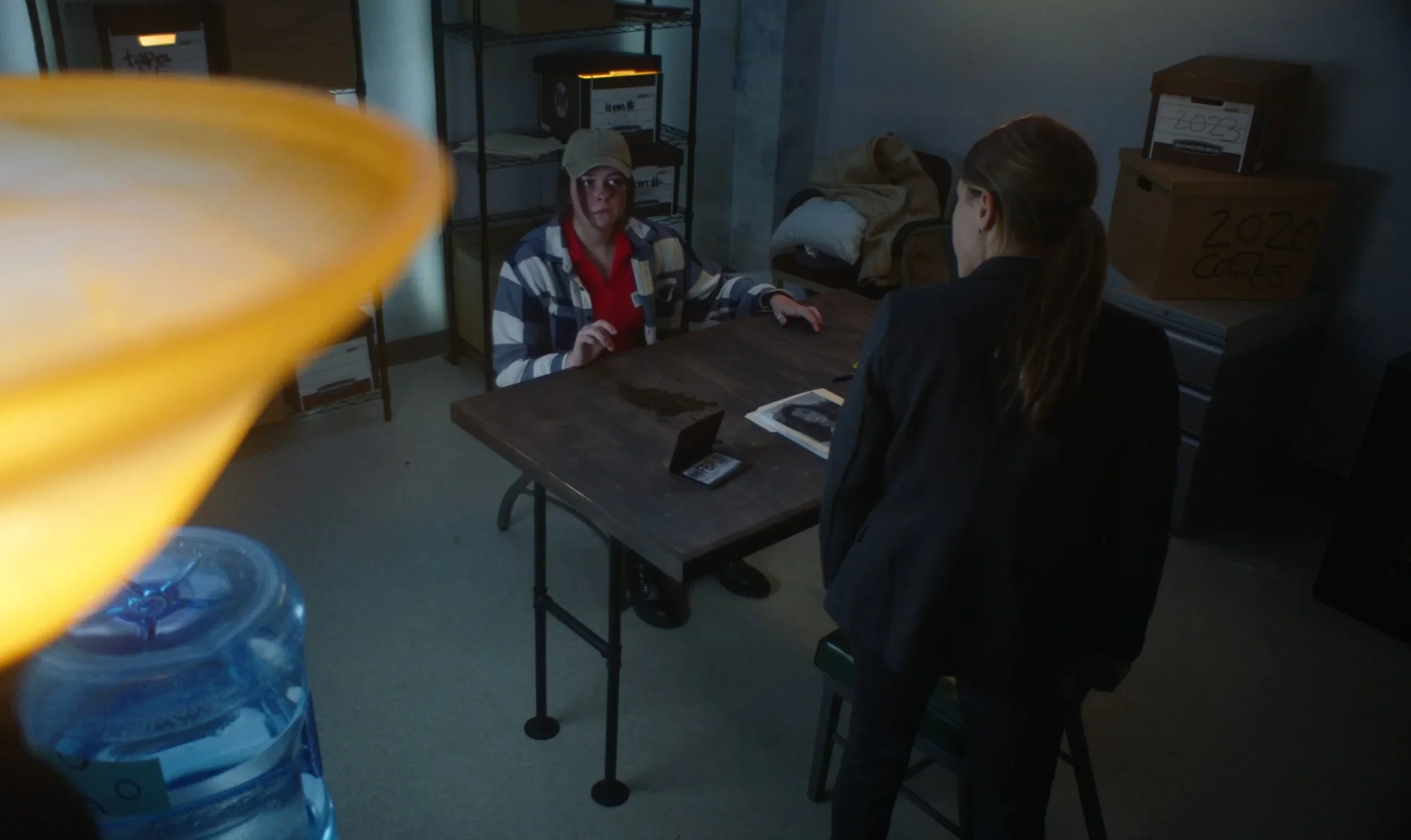 Downwards shot of the interrogation scenes in the film “Wolf in Lamb’s Skin.”