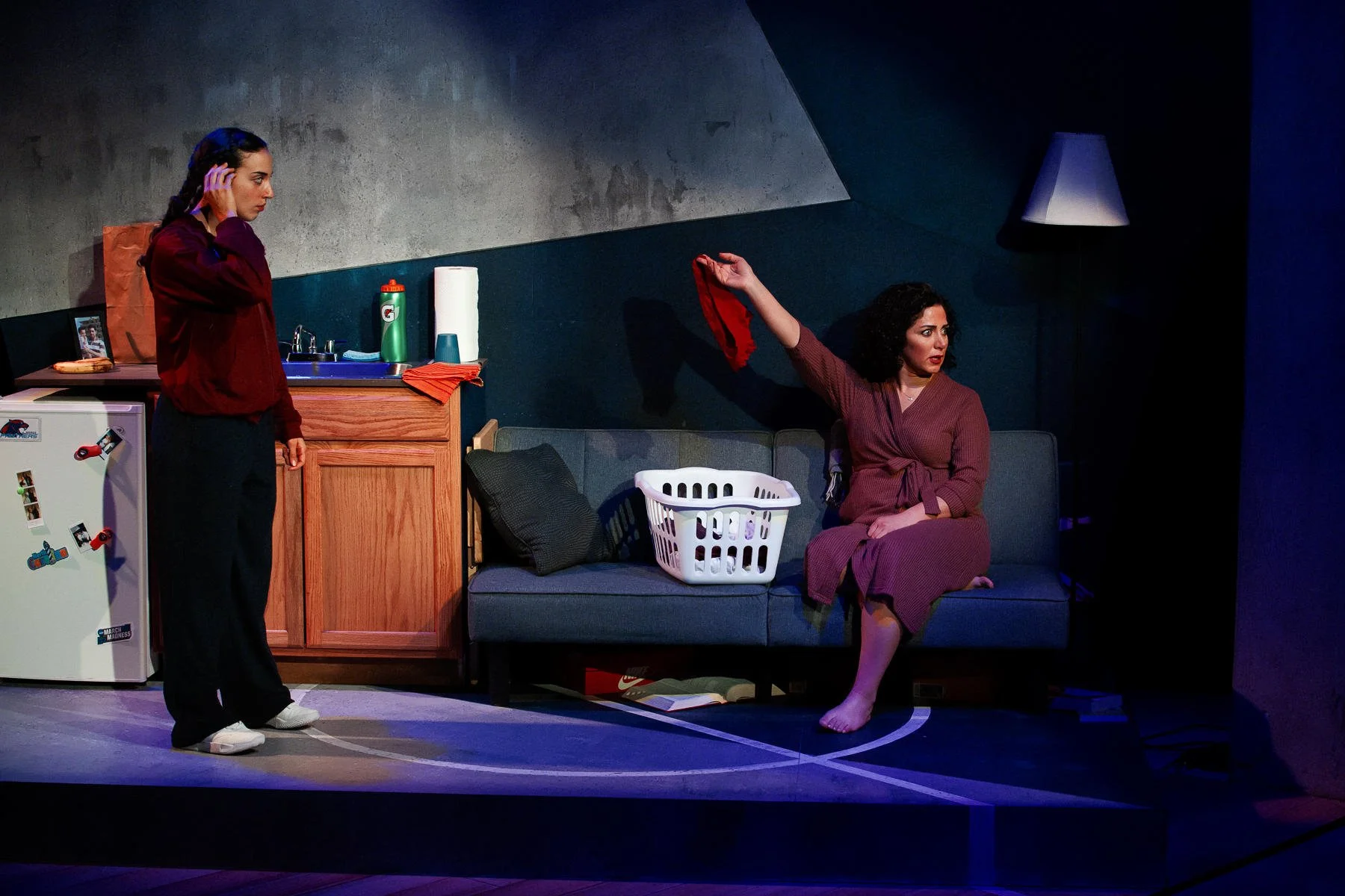 The dorm room set with props and dressing in the play “American Fast” by Kareem Fahmy