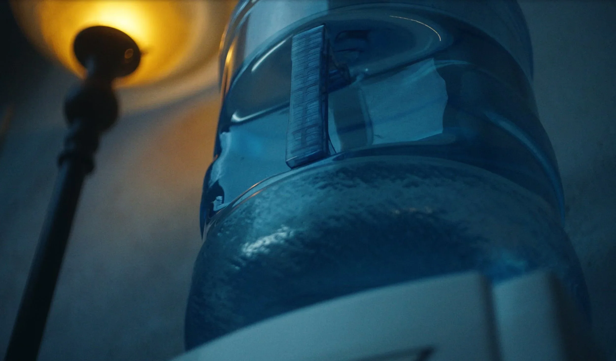 Close up still of the water jug, used to tell time progression in the film “Wolf in Lamb’s Skin.”