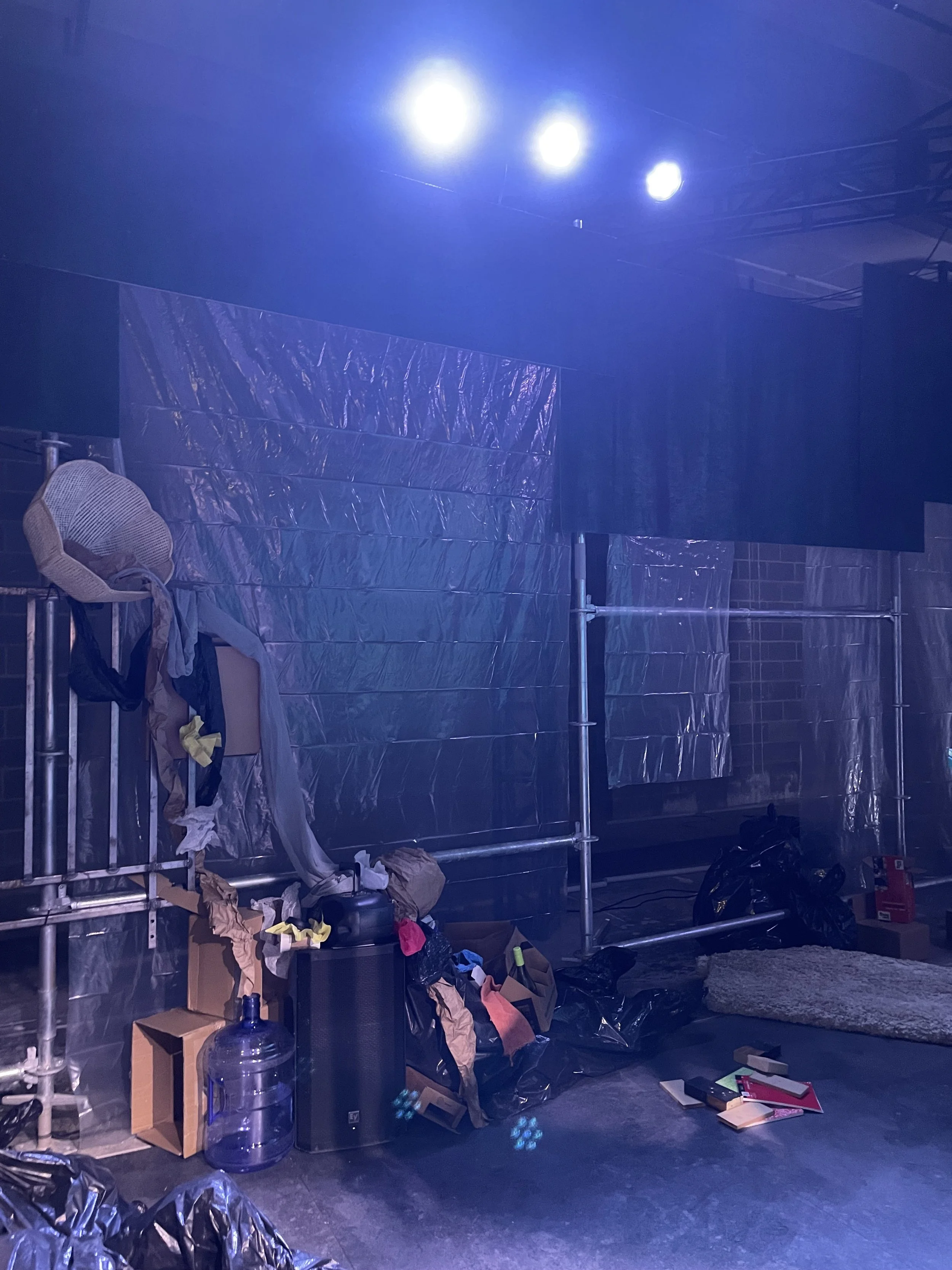 Close-up process shot of building sculptural trash piles for the set dressing of the play “The Garbologists” by Lindsay Joelle