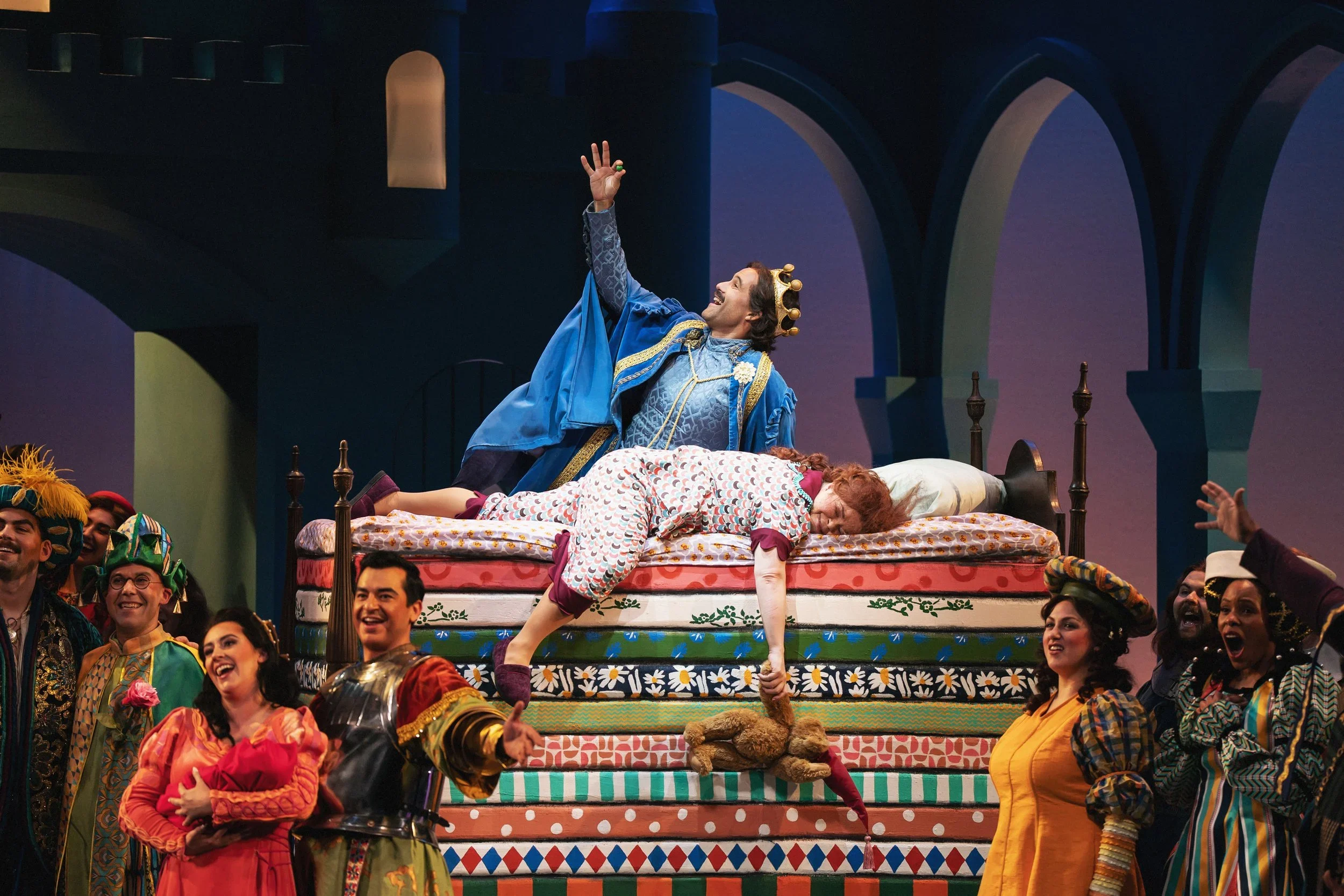Shot of the prince and princess on the designed and built bed, holding a small pea, in the ending of the opera “Once Upon a Mattress”