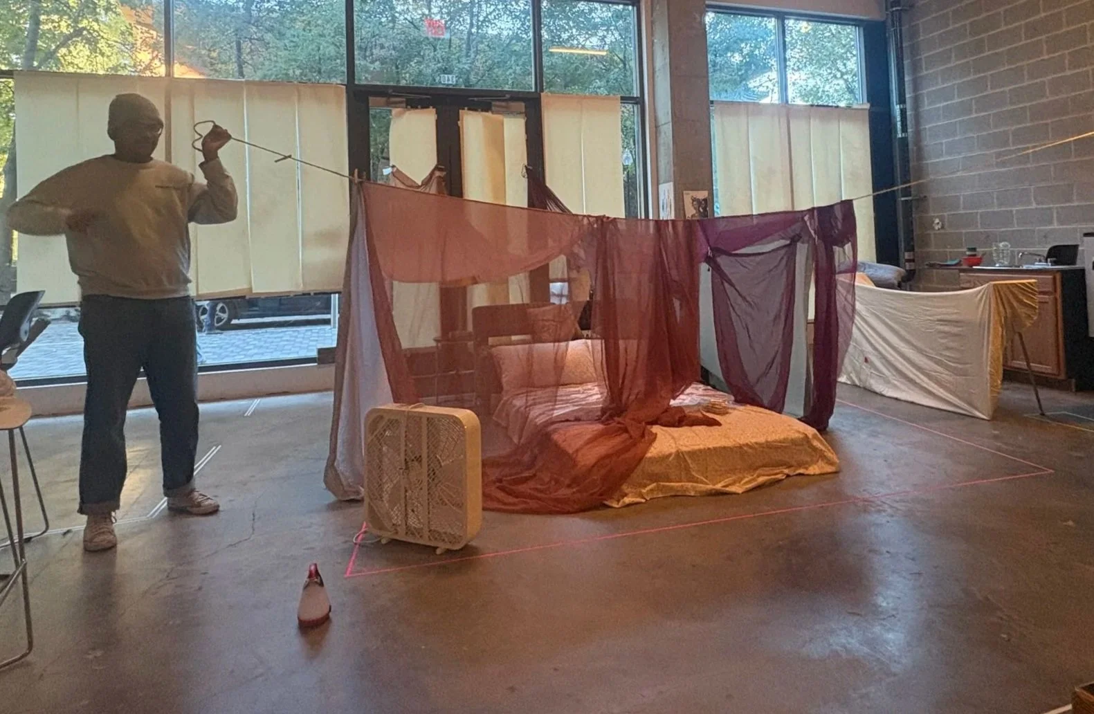Stage management and design team working to build a fort during rehearsals for the play “Furlough’s Paradise” by A.K. Payne