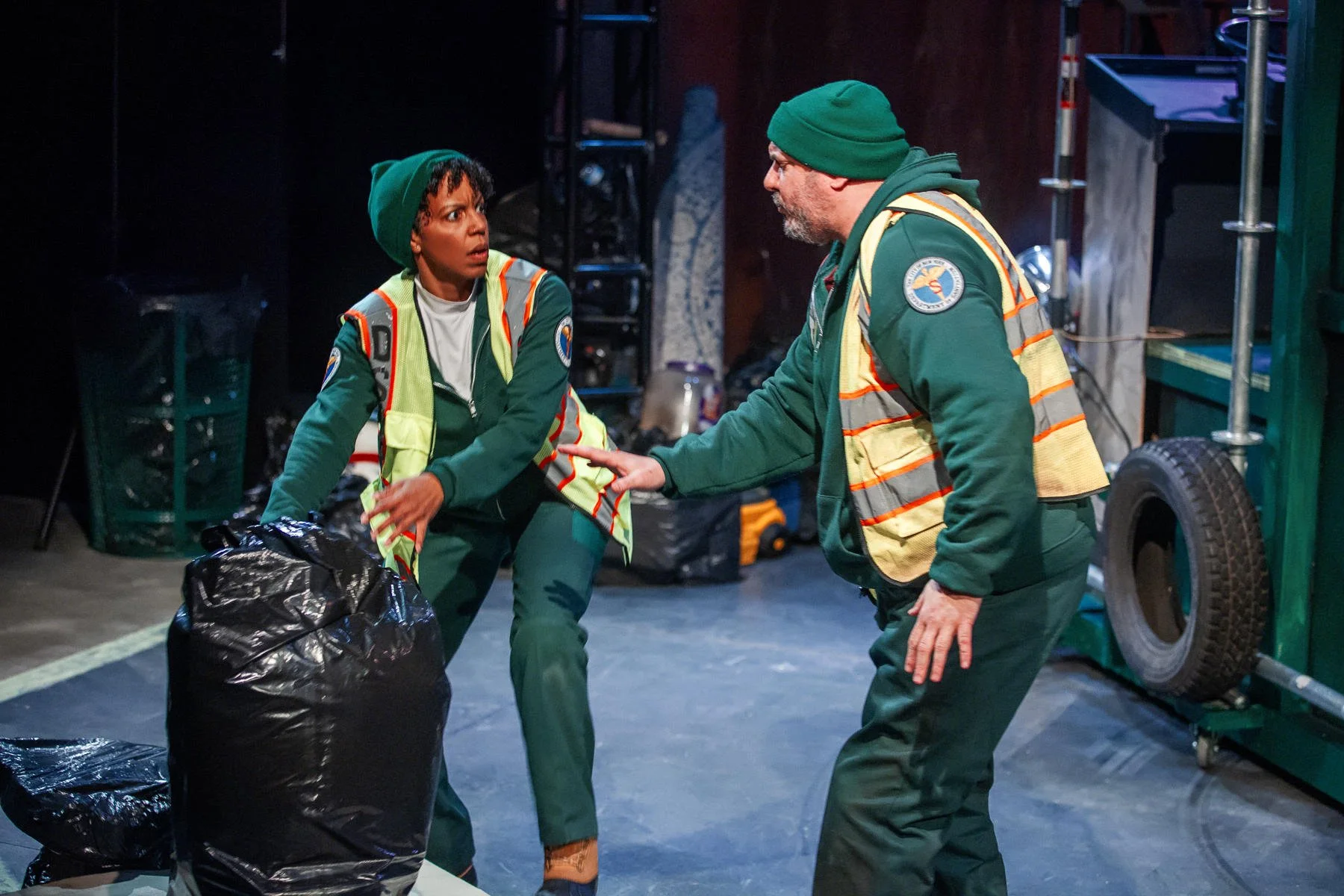 Danny and Marlowe arguing over a trash bag in the play “The Garbologists” by Lindsay Joelle