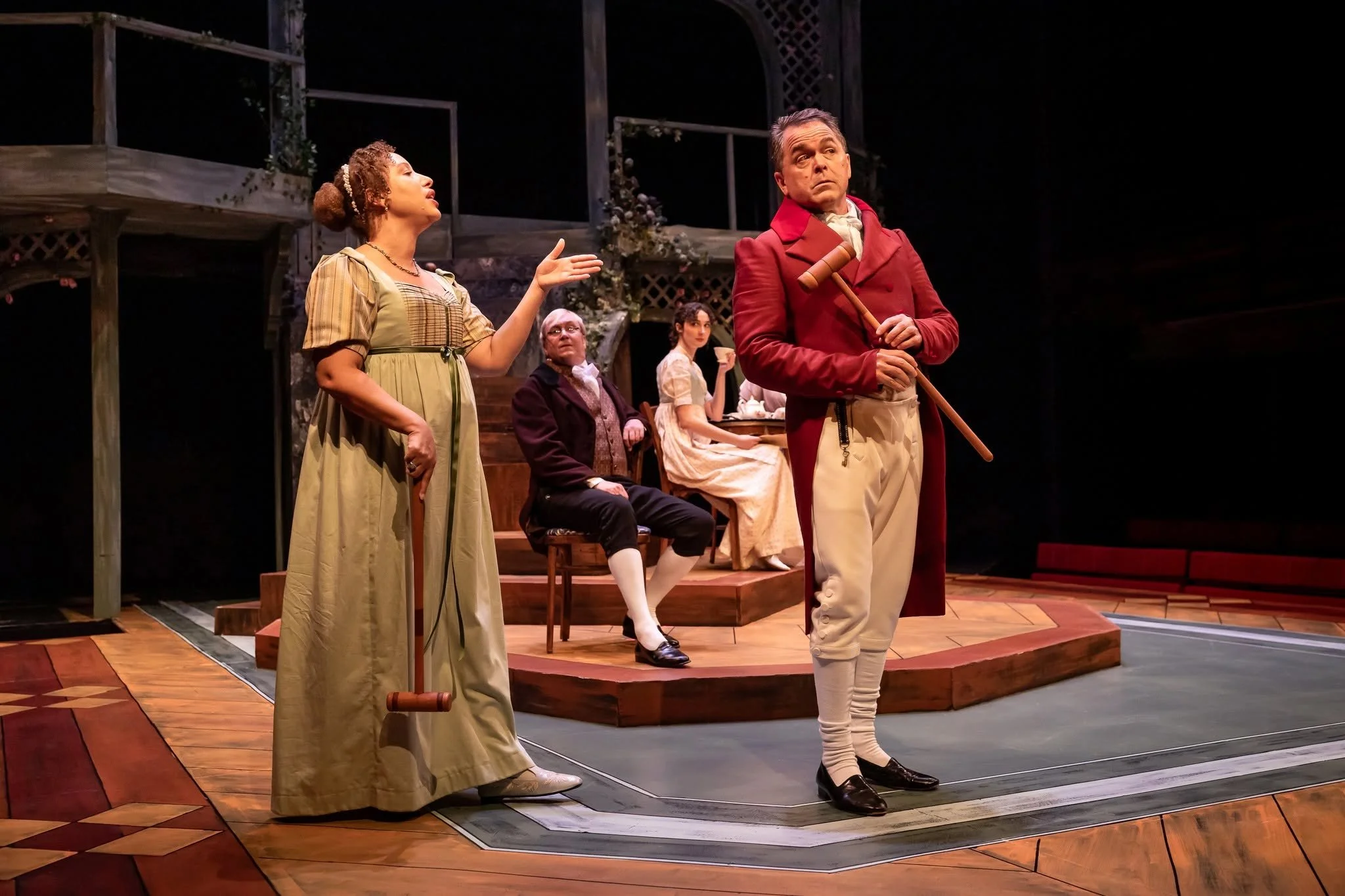 Actors with croquet mallets in the play “Persuasion” by Jane Austen, adapted by Sarah Rose Kearns