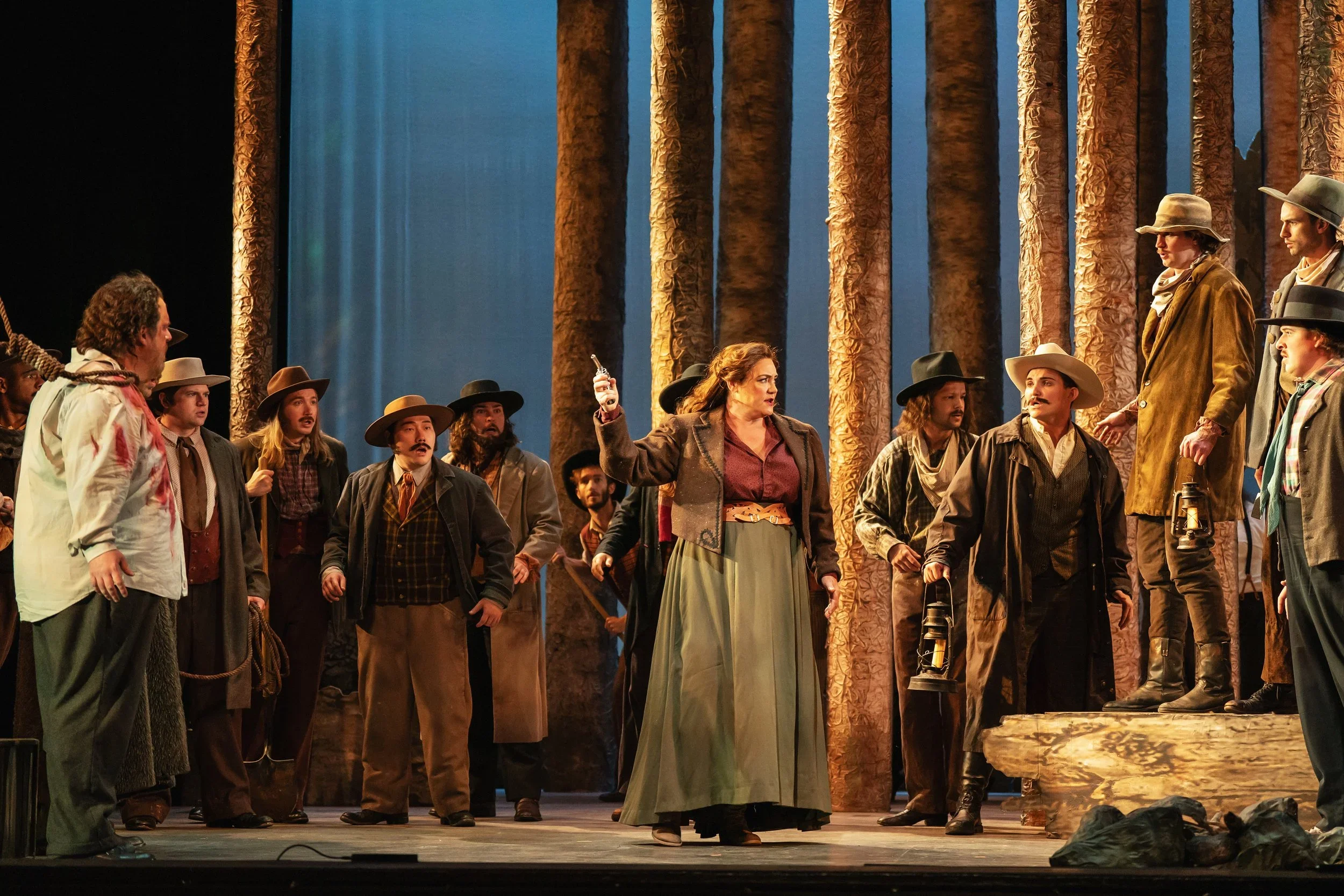 Minnie holding her pistol in the opera “La Fanciulla del West”