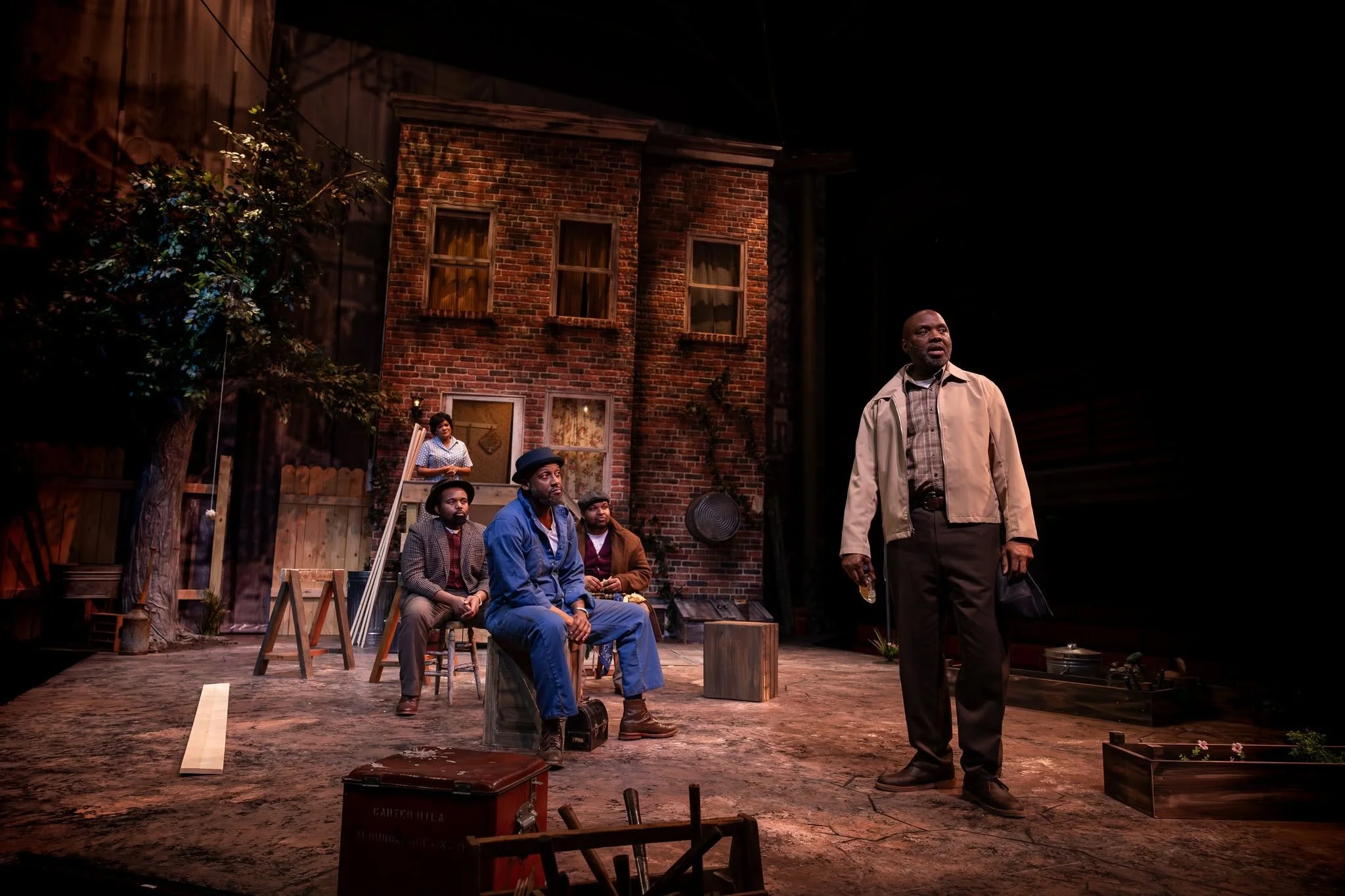 Wide-shot of the decorated yard onstage for the play “Fences” by August Wilson