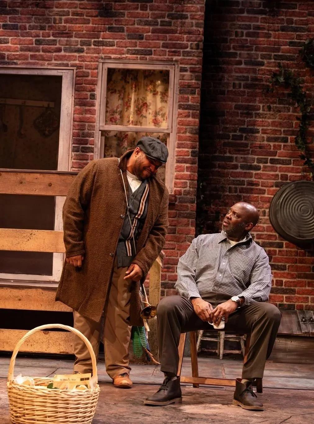 Close-up of Gabriel with his trumpet talking to Troy in the play “Fences” by August Wilson