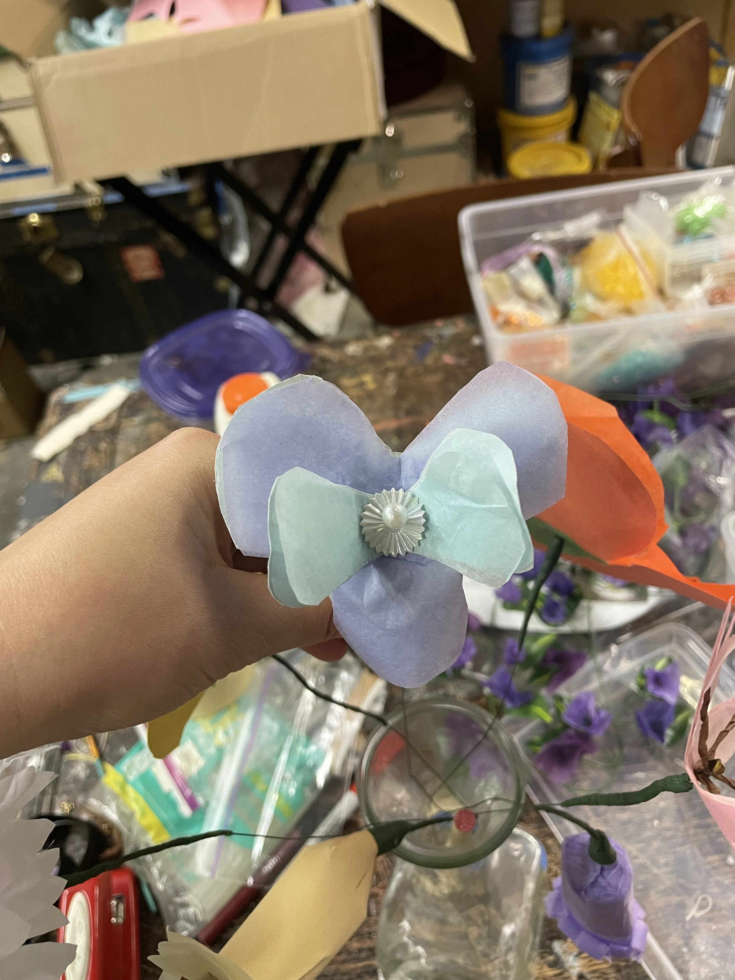 A handmade tissue paper flower for set decoration and prop use for the opera “The Pirates of Penzance”