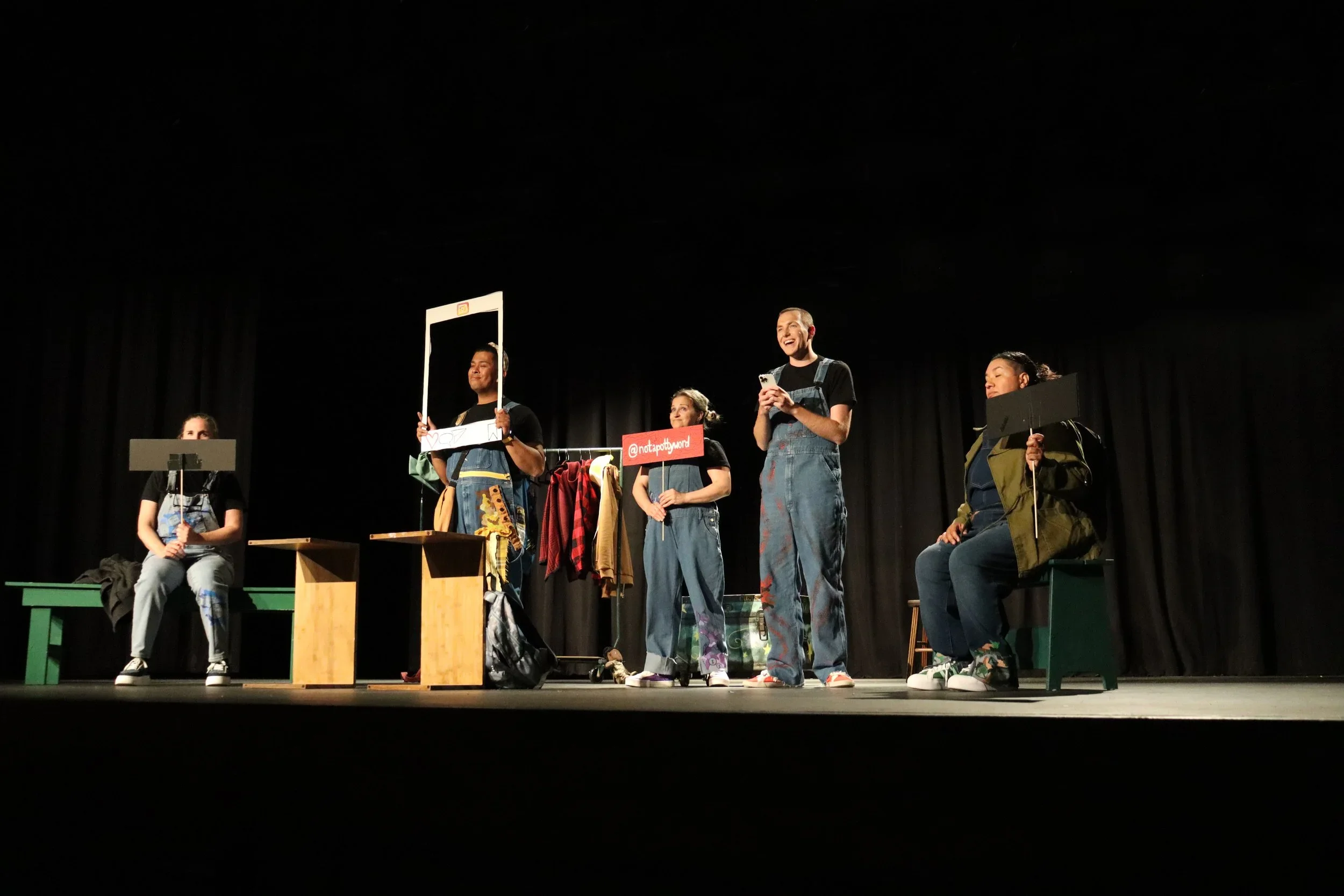 Cast of five with social media props onstage for the world premiere play “BRAT” by Wendy Maples