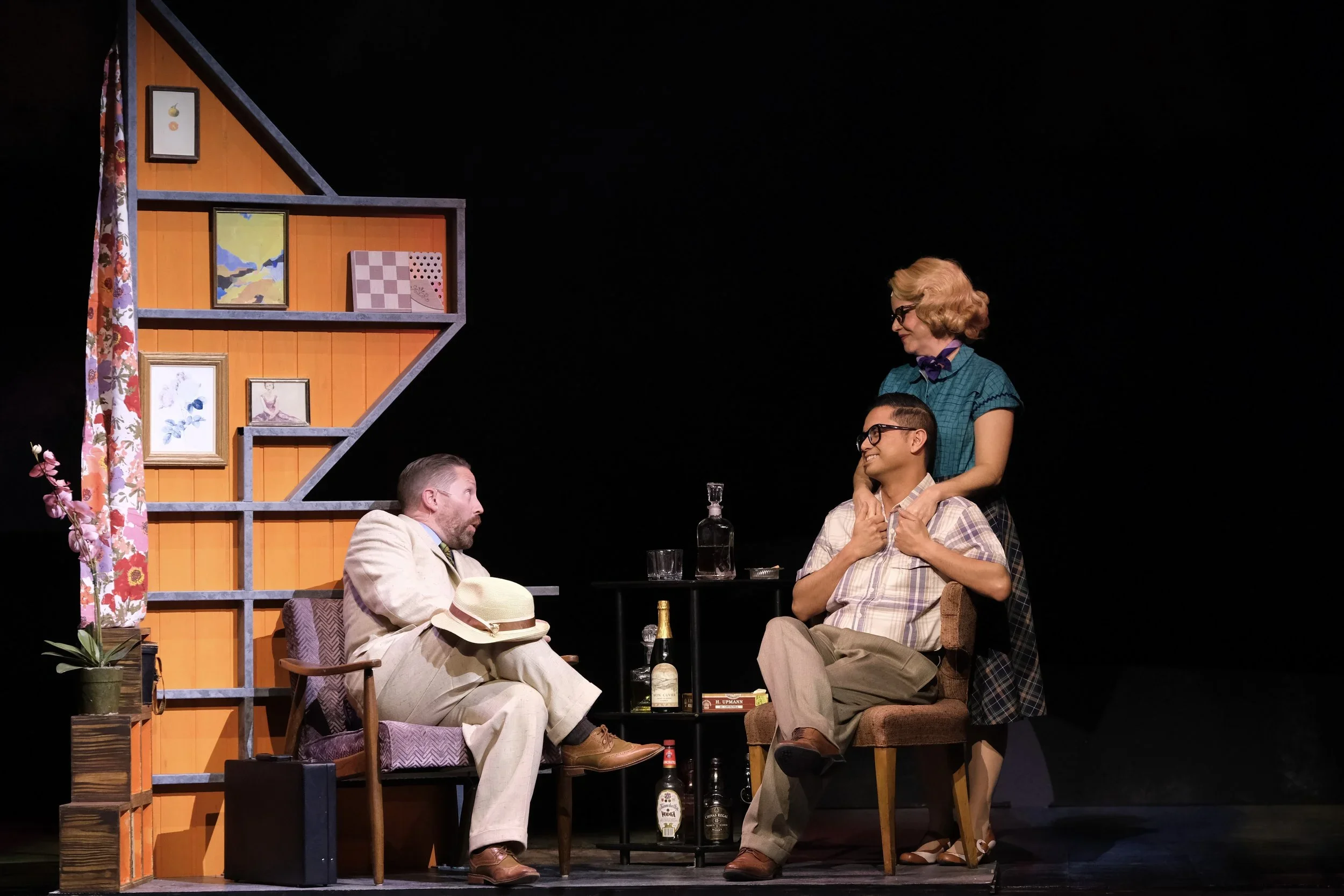 Scene of three people talking on the house set for the world premiere musical “In a Sunshine State.”