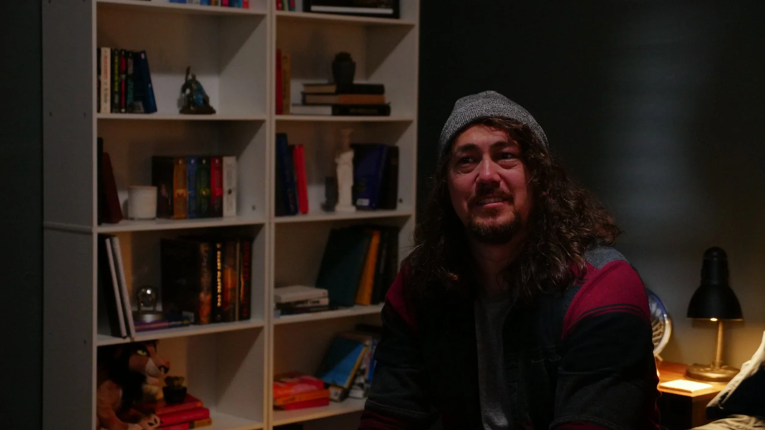 Film still against the bedroom wall and bookcase in the film “Bad Examples,” a television pilot.
