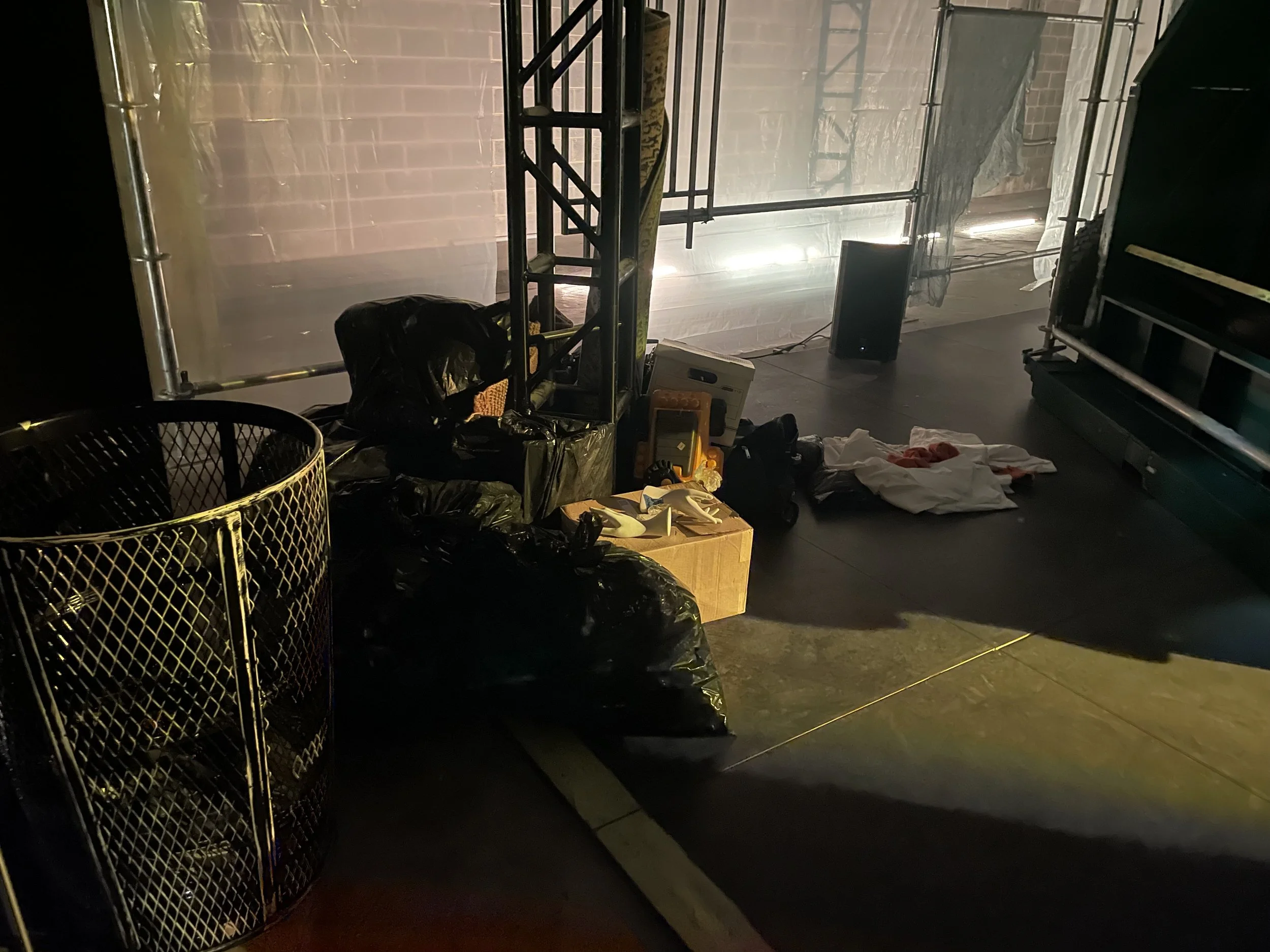 Close-up process shot of building sculptural trash piles for the set dressing of the play “The Garbologists” by Lindsay Joelle