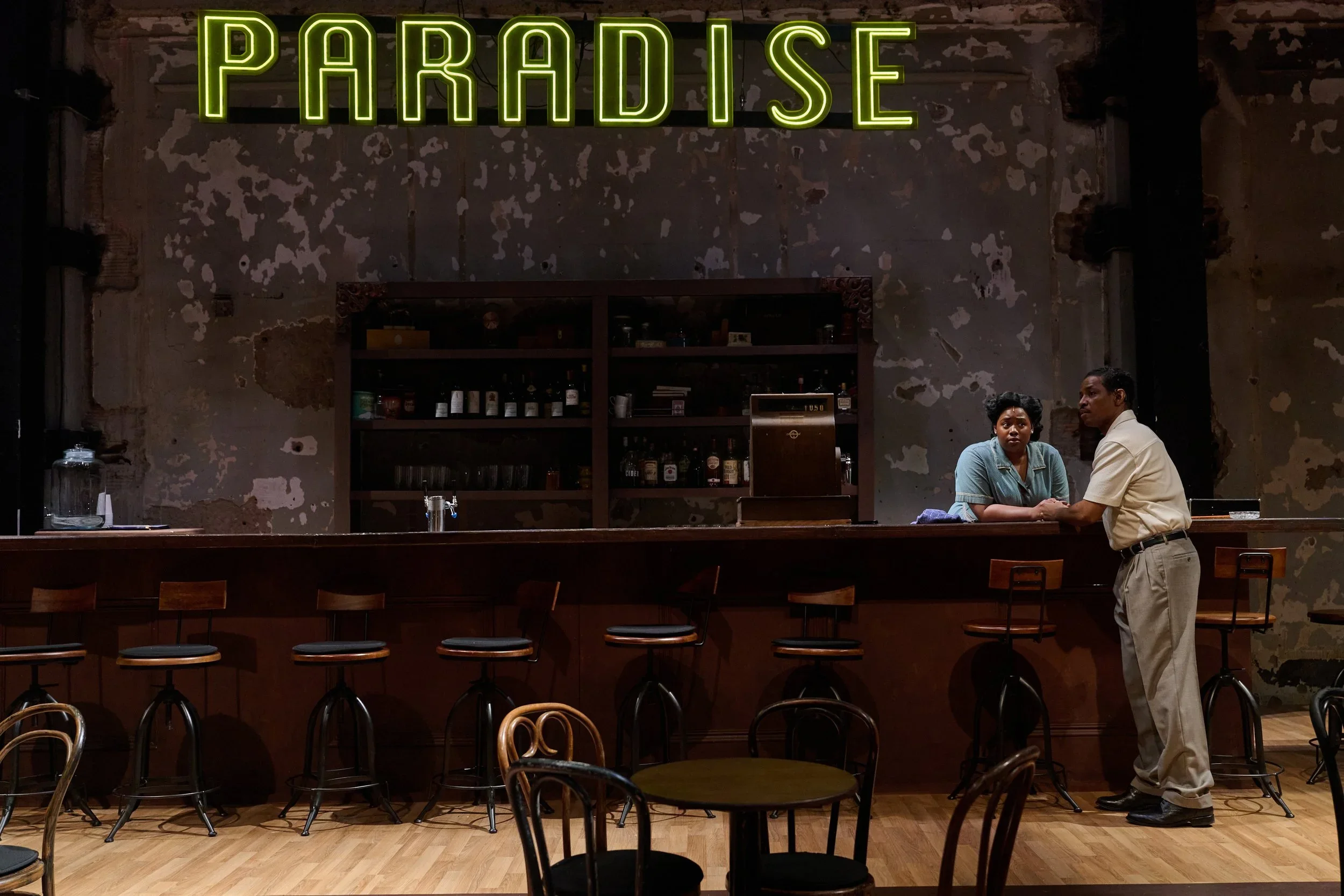 The bar and hanging neon sign in the jazz club set for the play “Paradise Blue” by Dominique Morisseau