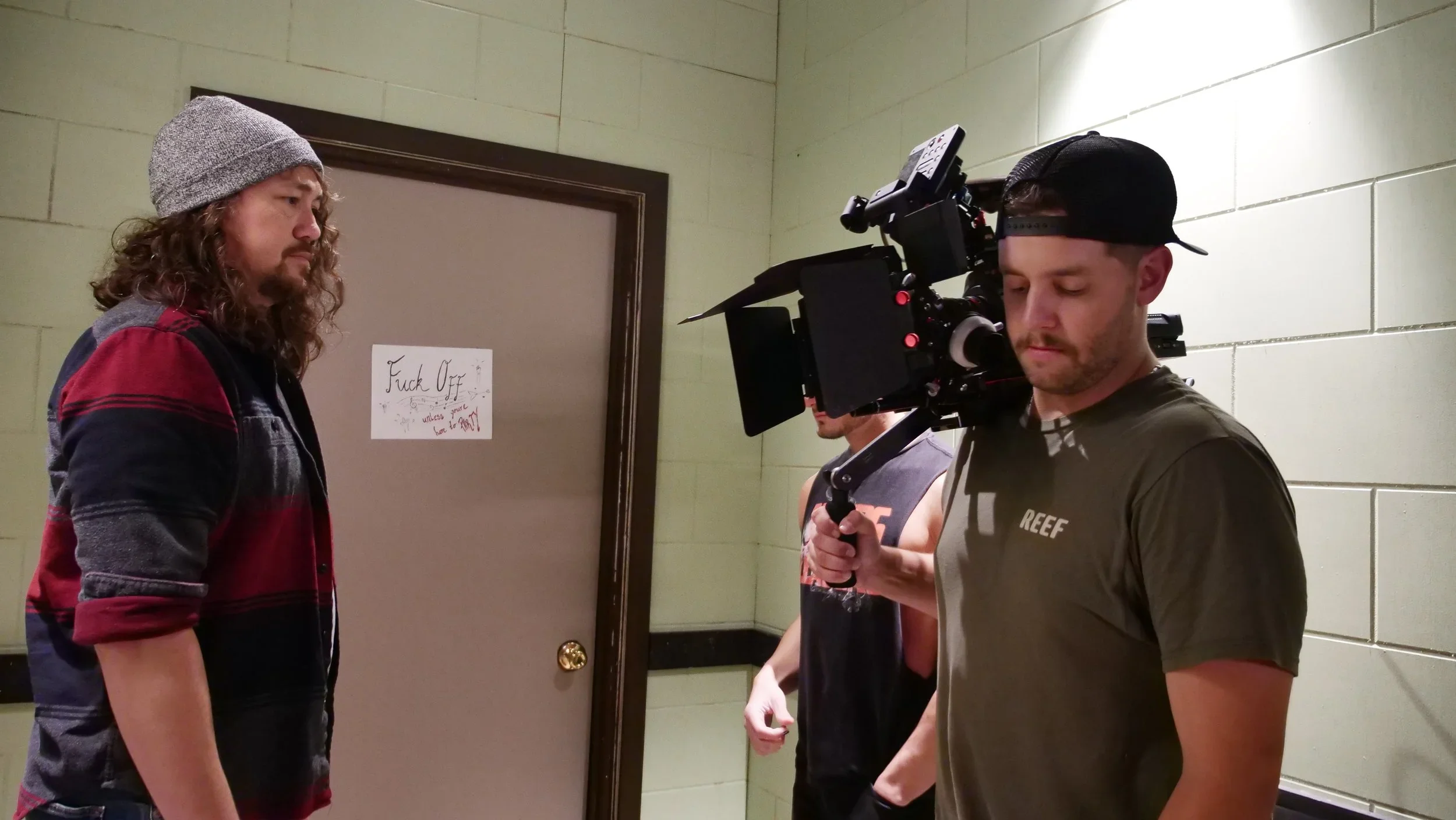 Behind the scenes photo of the DP shooting on the hallway set of the film “Bad Examples,” a television pilot.