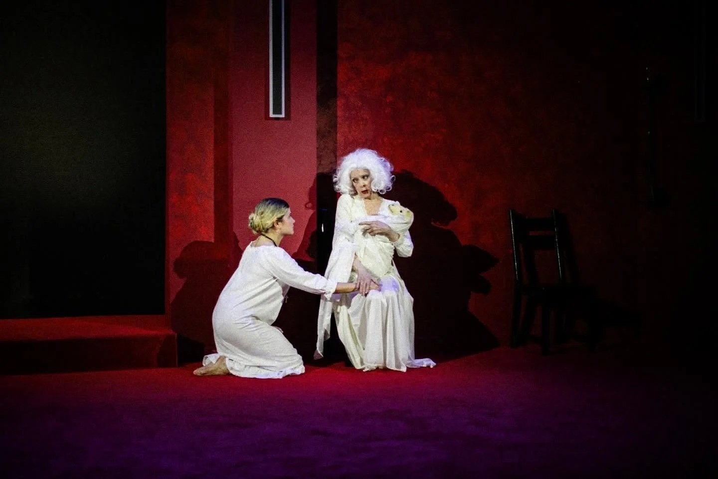 An old woman holding a sheep onstage for the play “La Casa de Bernarda Alba” by Federico García Lorca