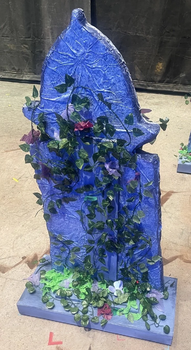 A close-up of the set decorated with tissue paper flowers made for the opera “The Pirates of Penzance”
