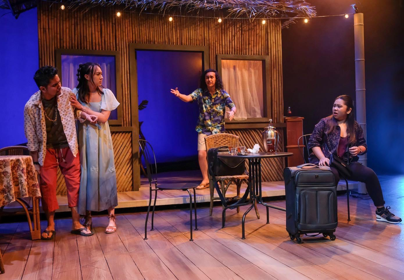 Characters arguing on the cafe set of the play “Bloodletting” by Boni Alvarez